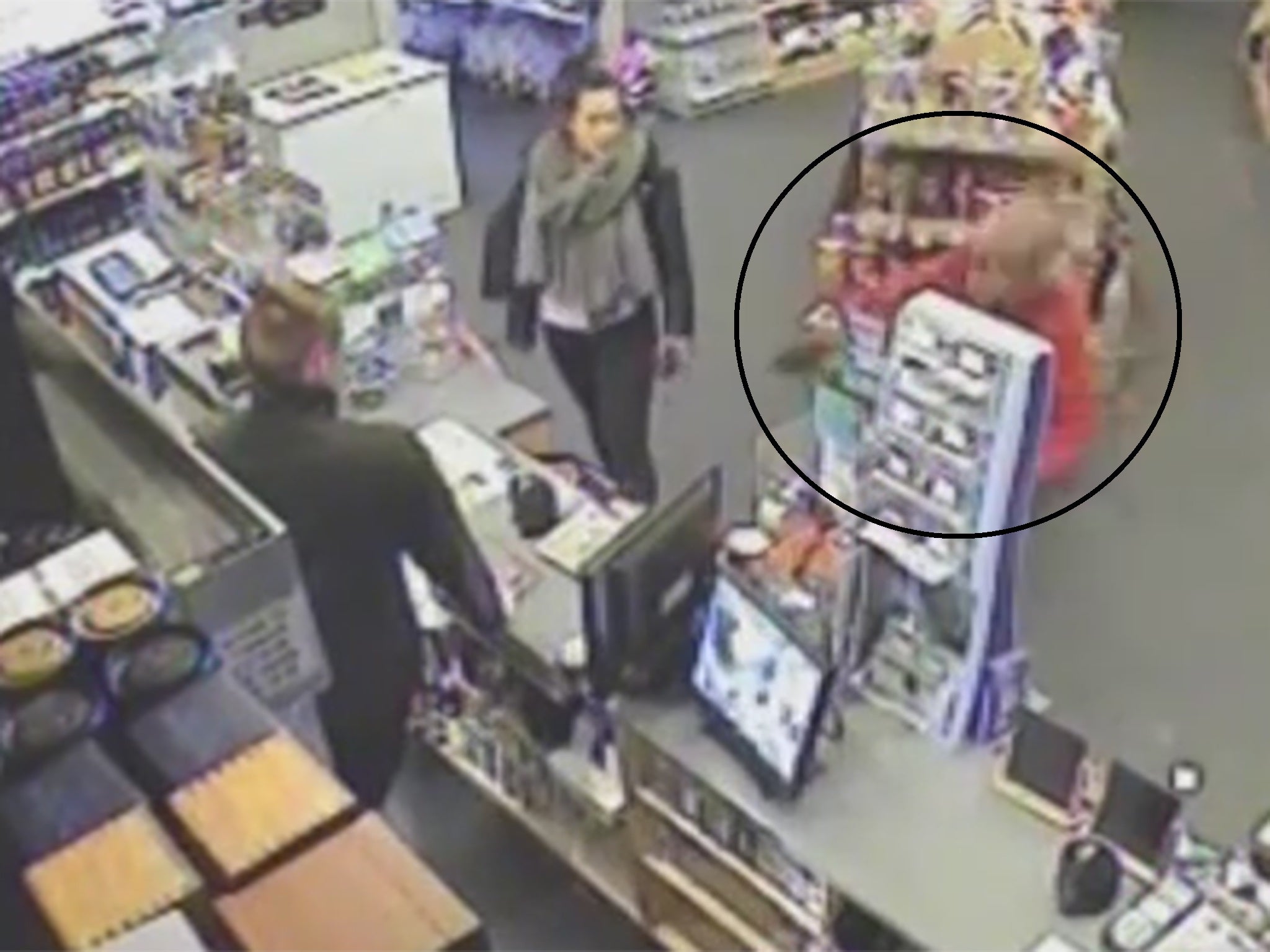 The moment the armed robber slips over