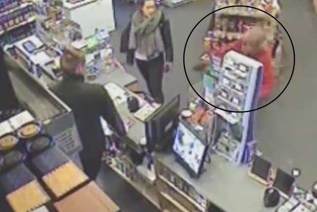 The moment the armed robber slips over