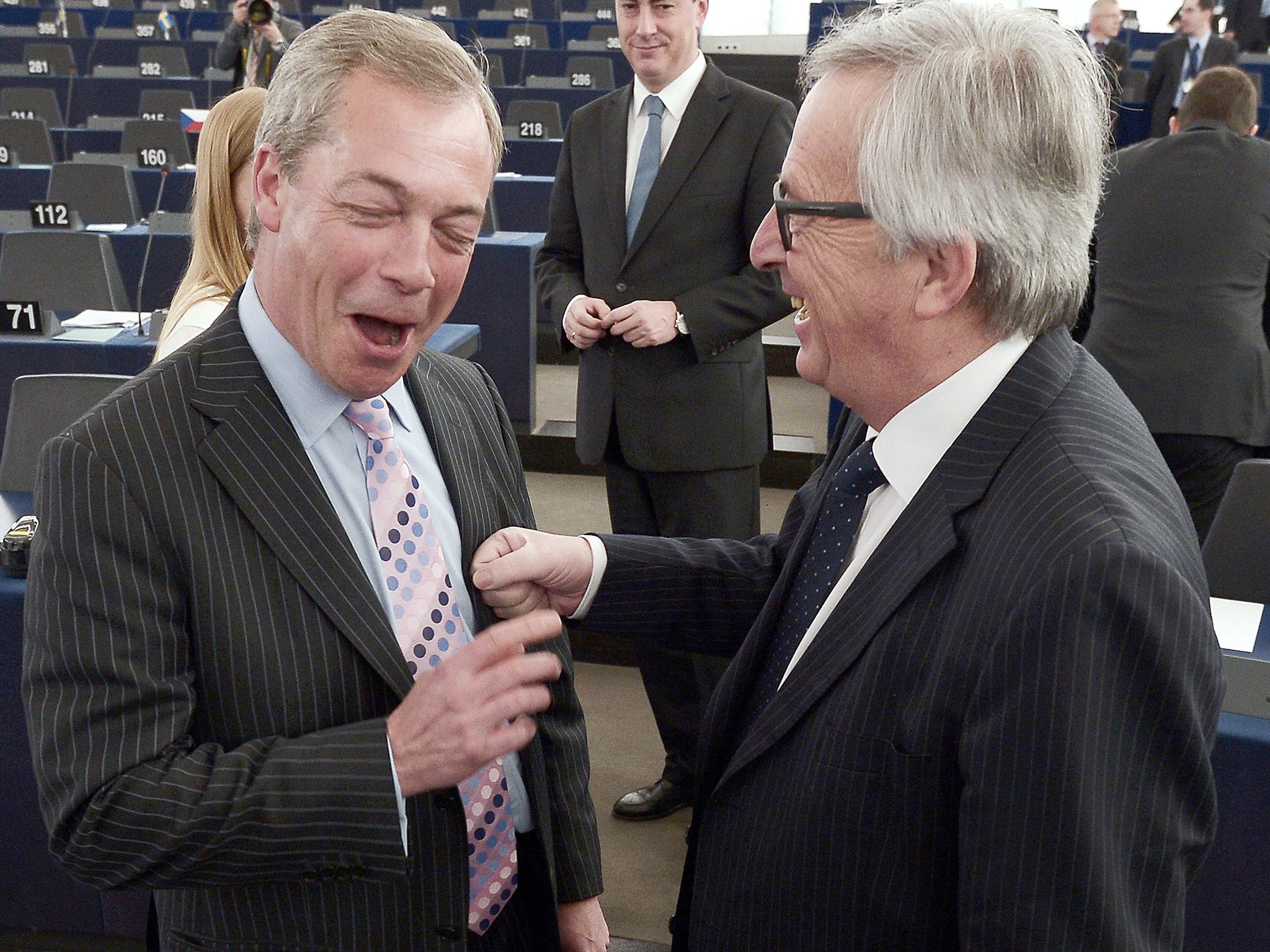 Nigel Farage and Jean Claude Juncker share a joke at the European Parliament in Strasbourg, France, on Wednesday