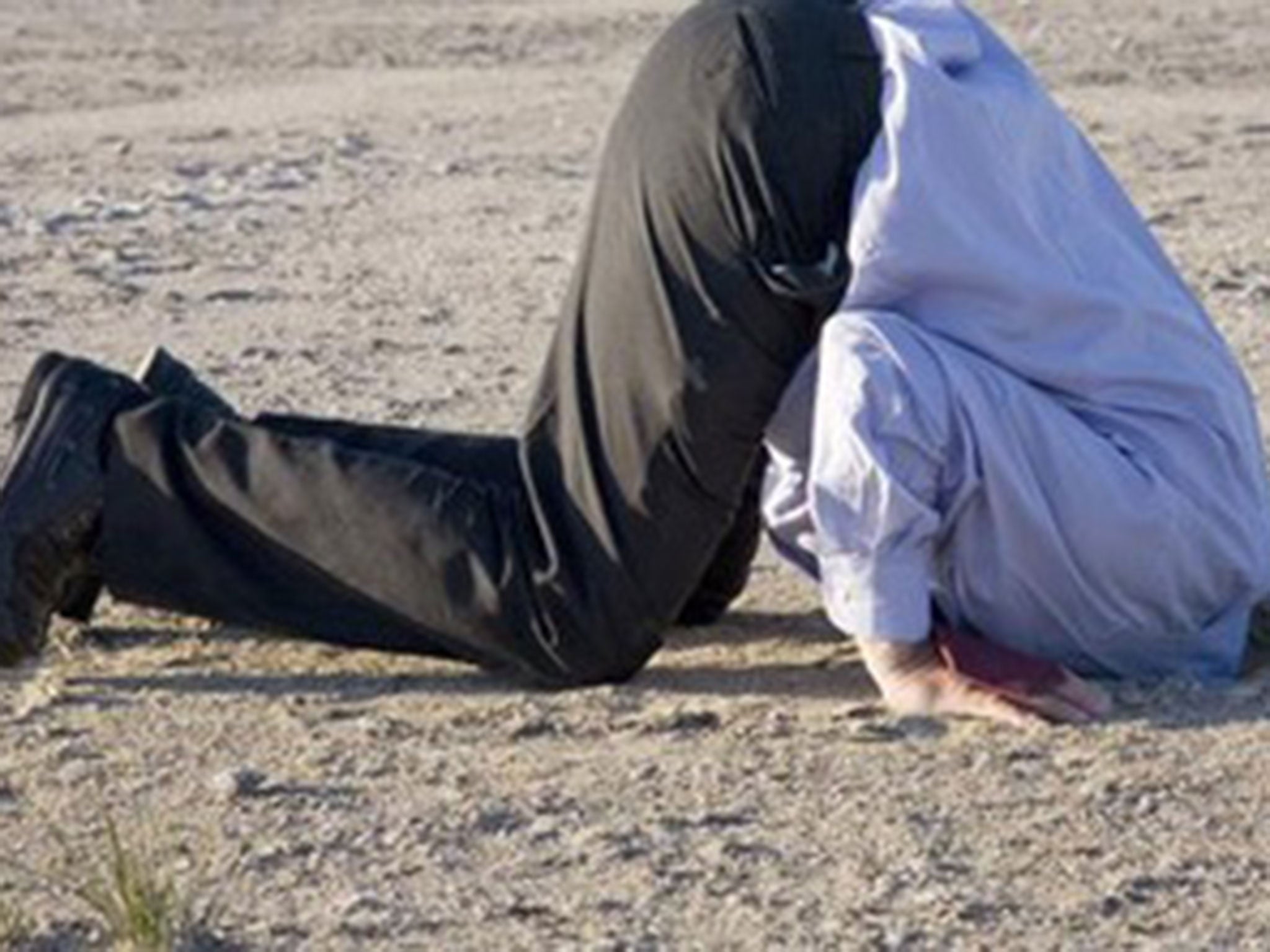A picture of someone with their head in the sand