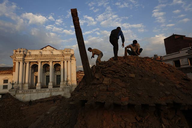 Nepalese students and volunteers clear the rubble at Kathmandu Durbar Square, a UNESCO World Heritage Site