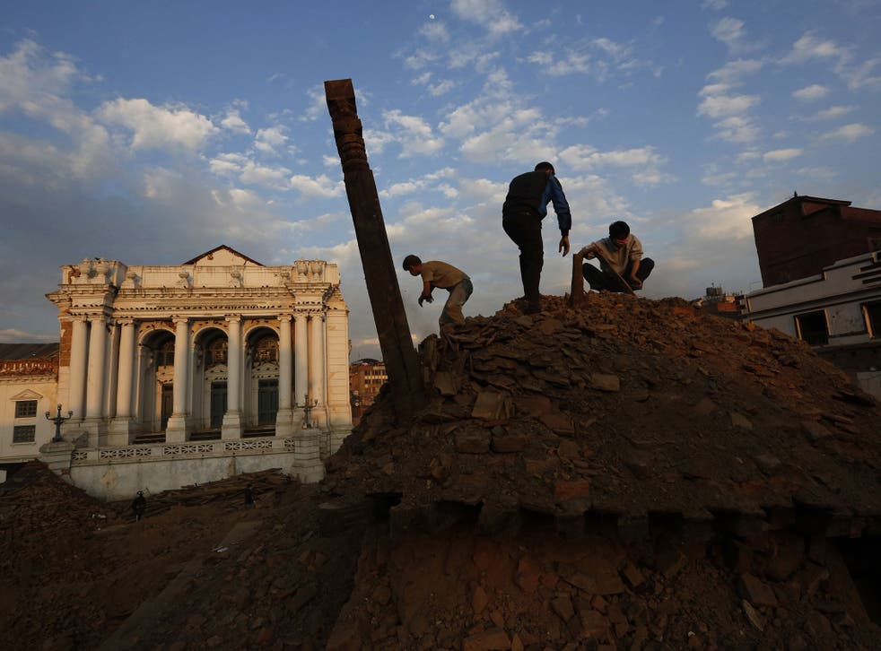 Nepalese students and volunteers clear the rubble at Kathmandu Durbar Square, a UNESCO World Heritage Site