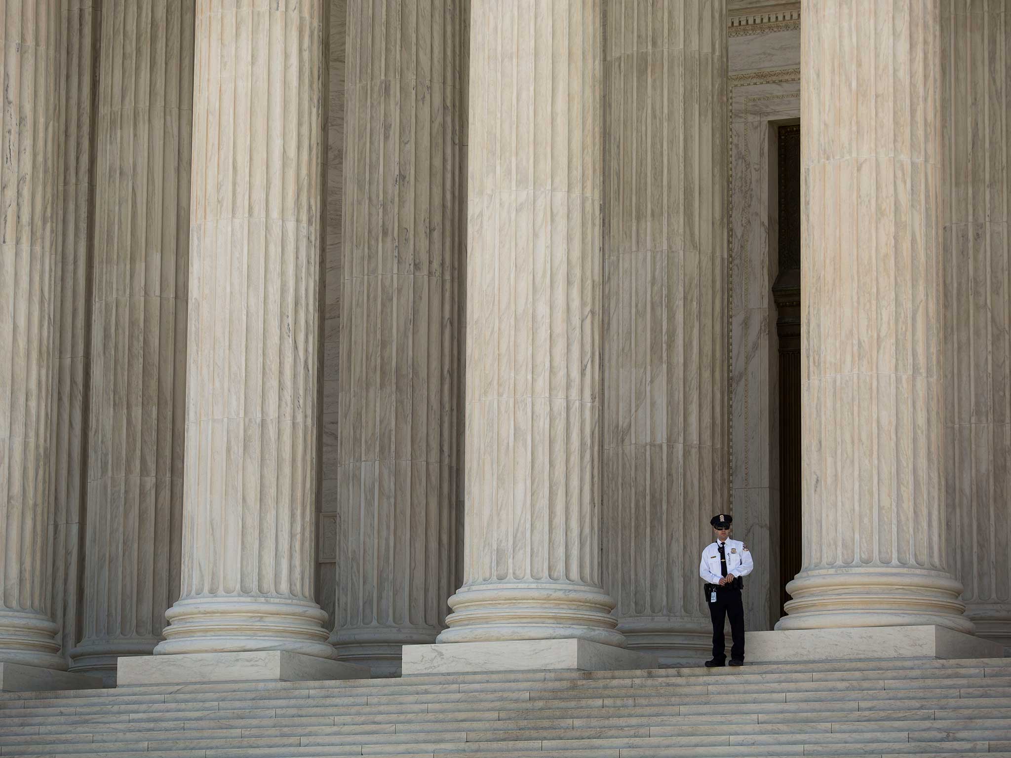 A US policeman outside the Supreme Court