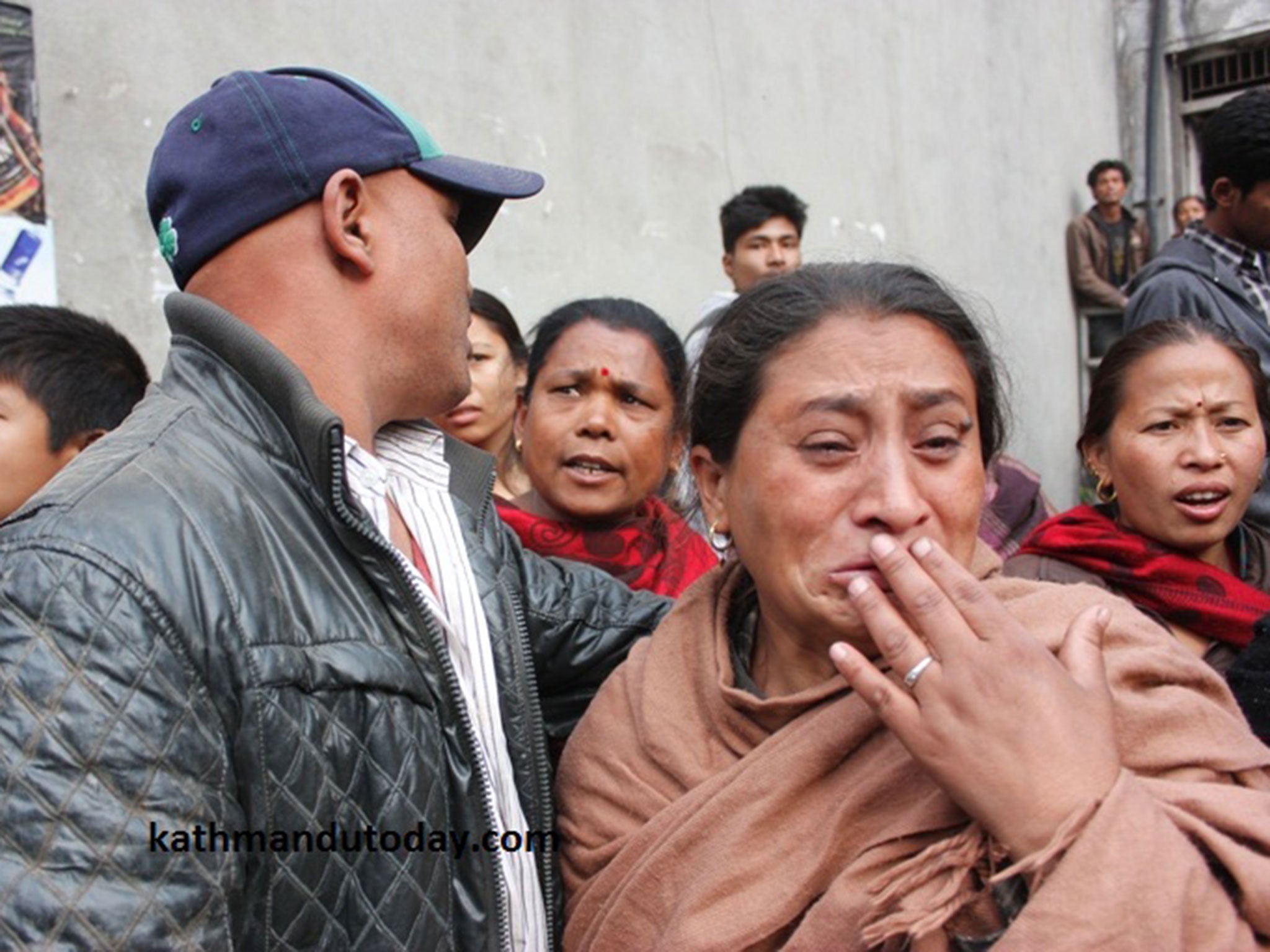 The parents watch on as their son is rescued