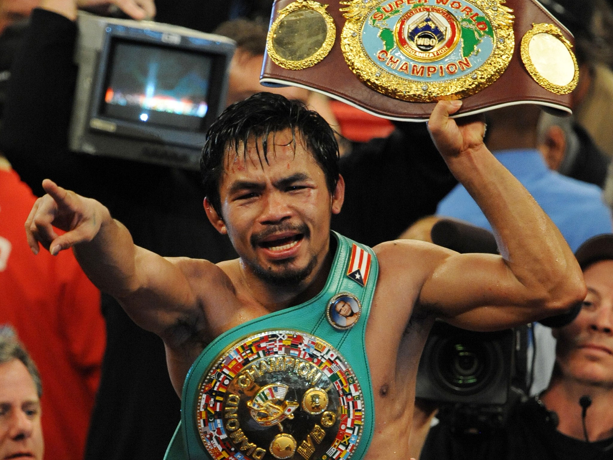 Manny Pacquiao celebrates his victory over Miguel Cotto in November 2009