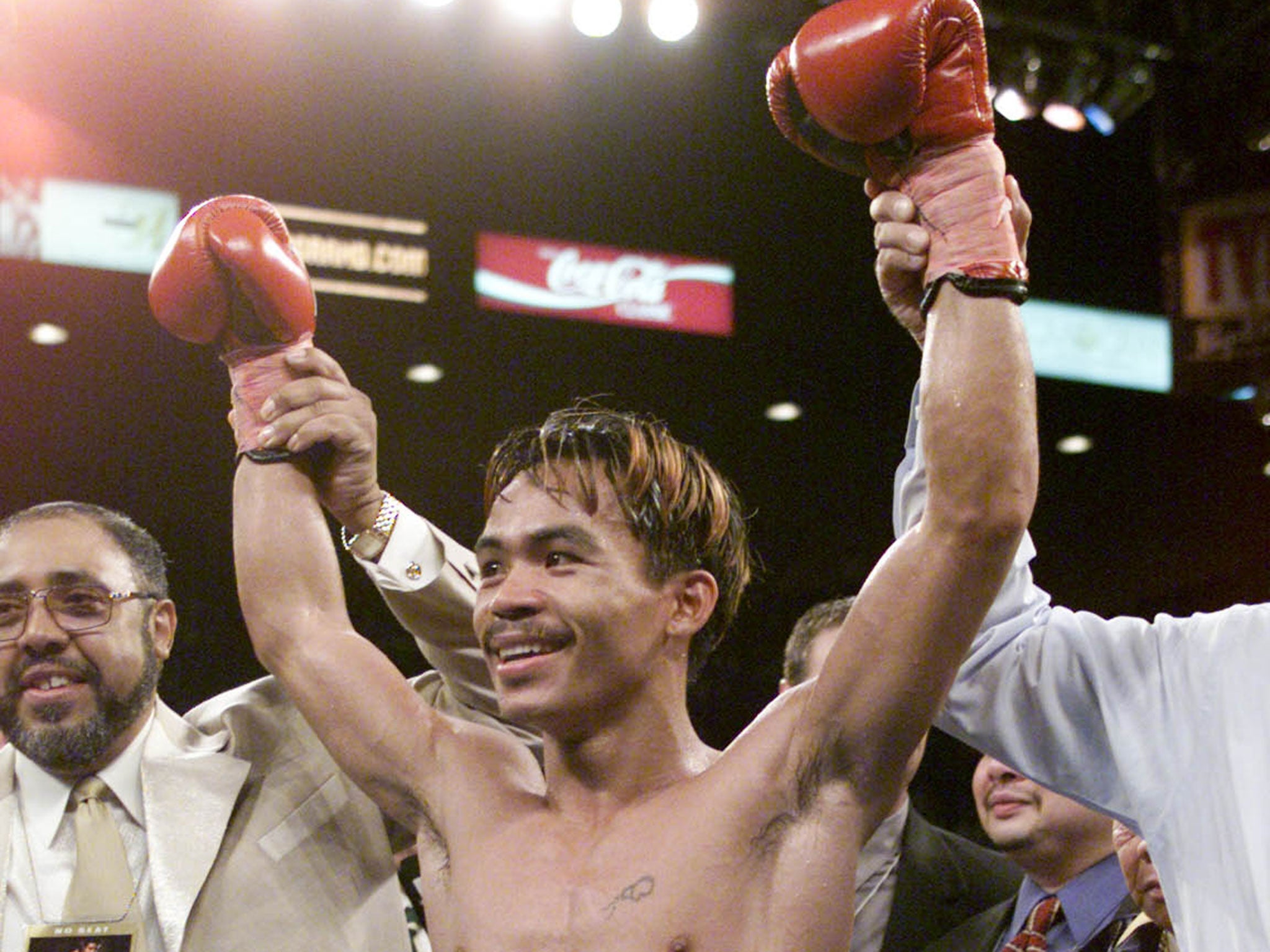 Pacquiao celebrates after IBF super-bantamweight title win in 2001