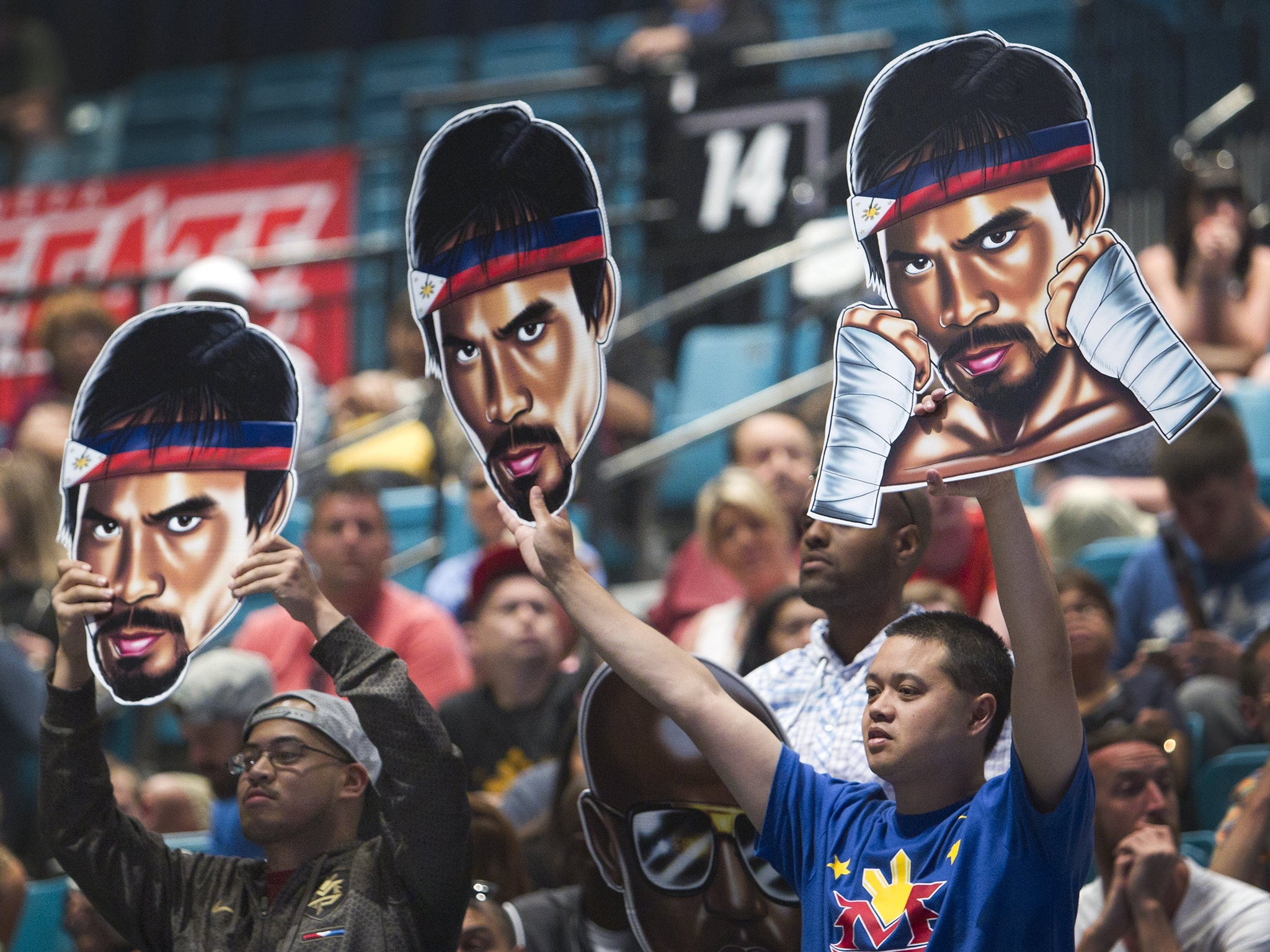 Pacquiao fans hold images of their idol