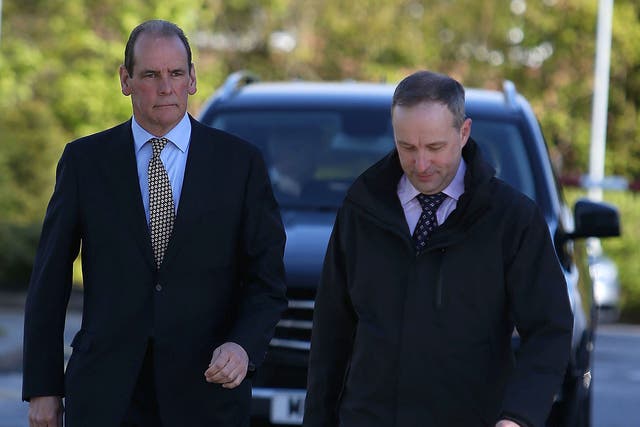 Sir Norman Bettison (left) arrives to give evidence at the inquests in Warrington
yesterday