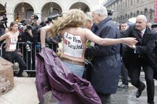 Topless protesters disrupt French far-right leader