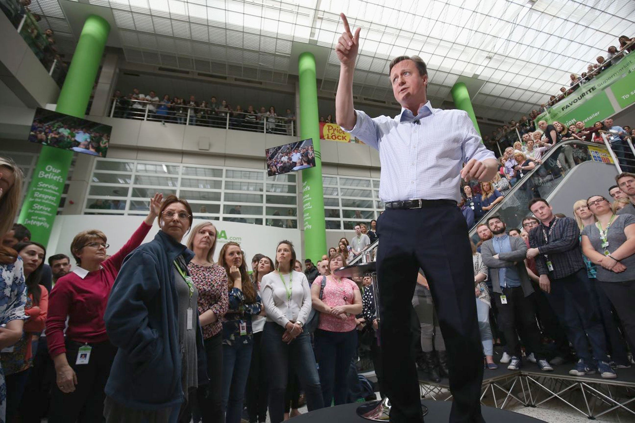 Promises, promises: David Cameron talks to staff at Asda's head office in Leeds today