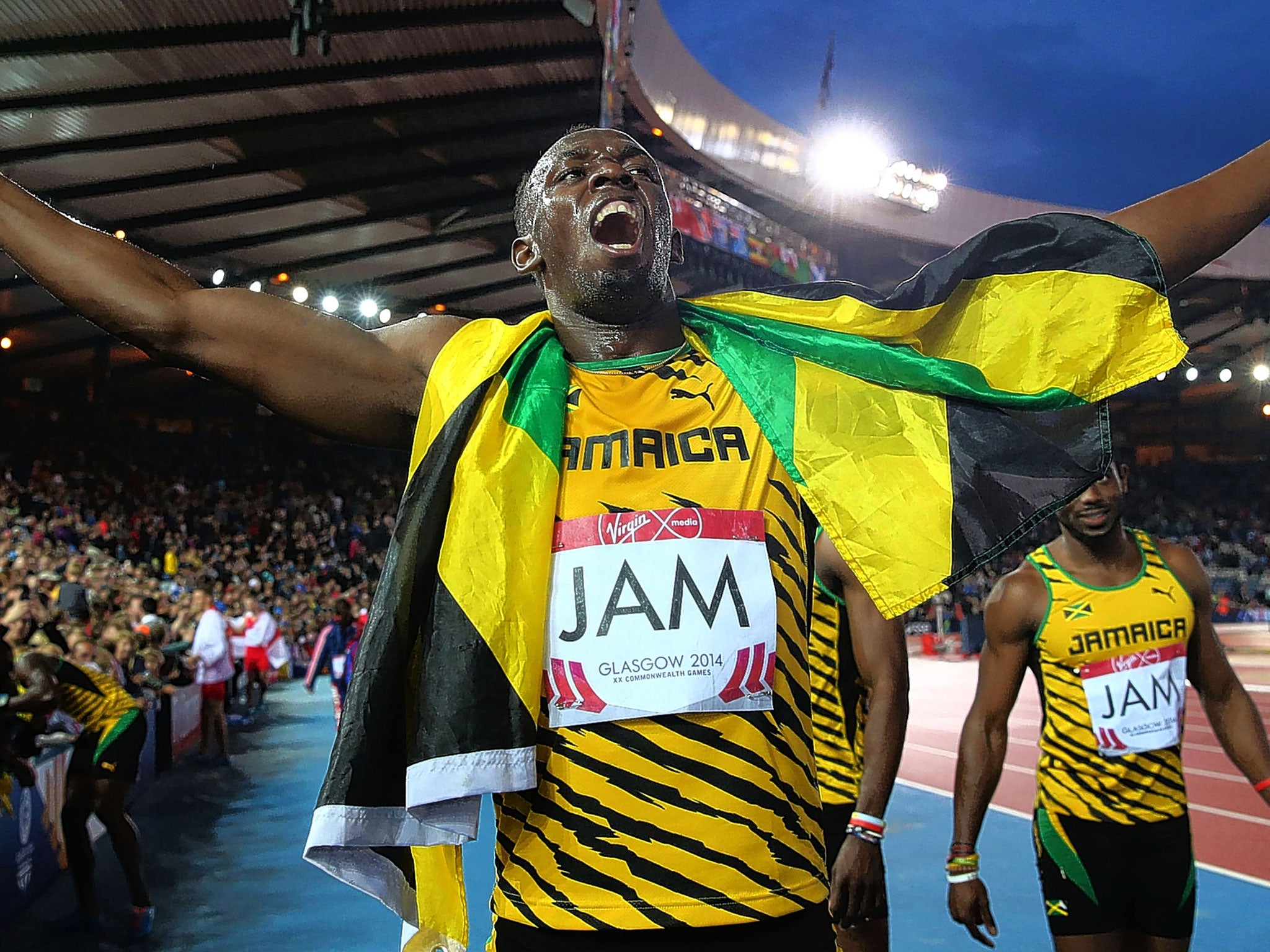 Usain Bolt celebrates after anchoring Jamaica to 4x100m relay gold in the Commonwealth Games in Glasgow last year