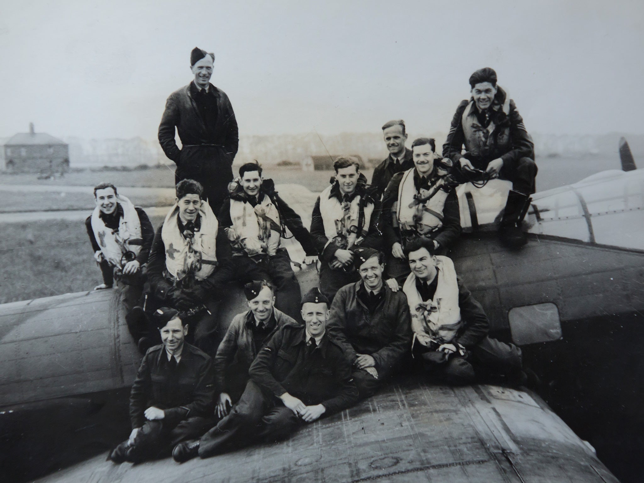 Tolley, second right (standing) with his crew mates