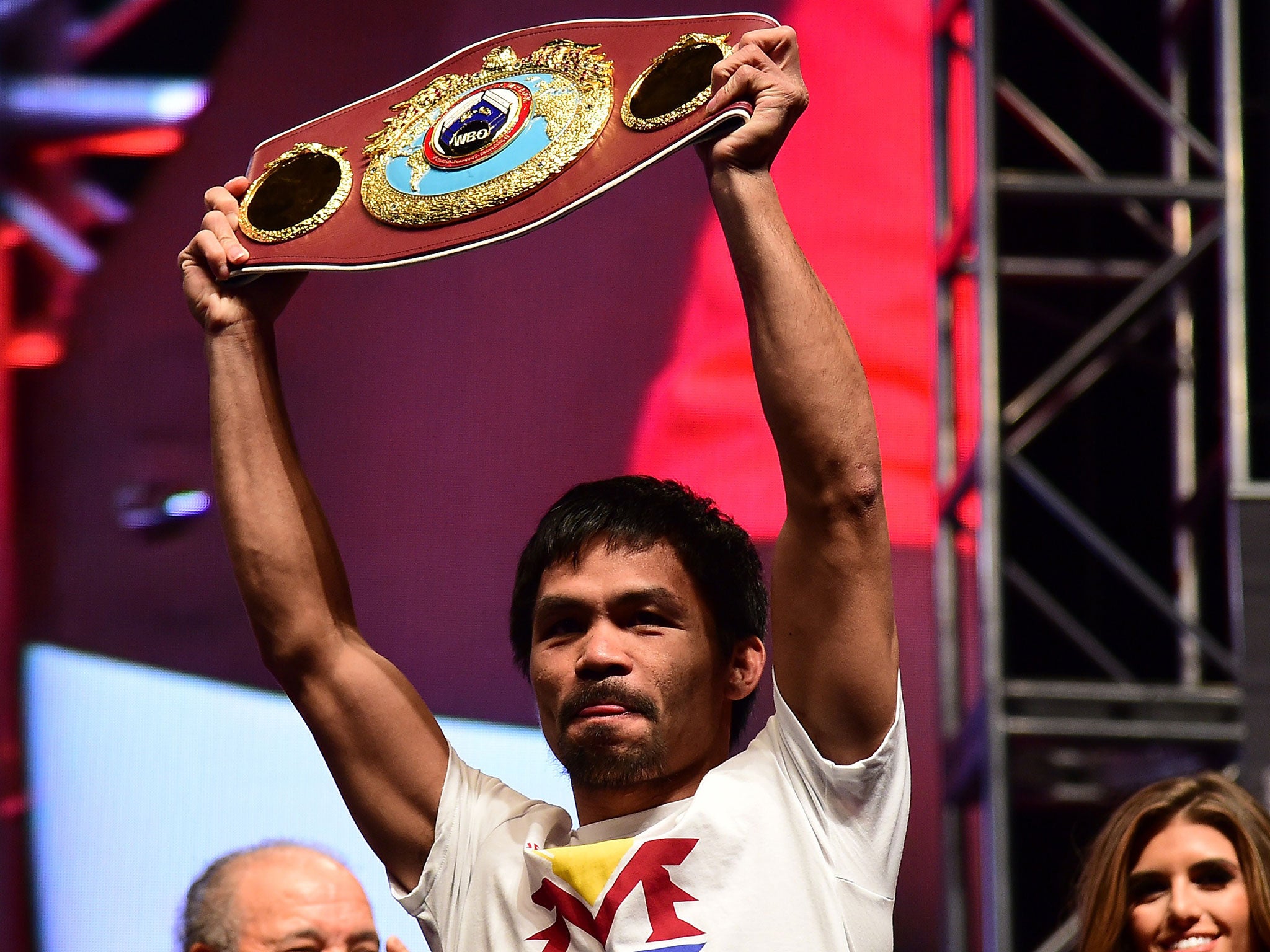 Manny Pacquaio holds up his WBO welterweight championship
