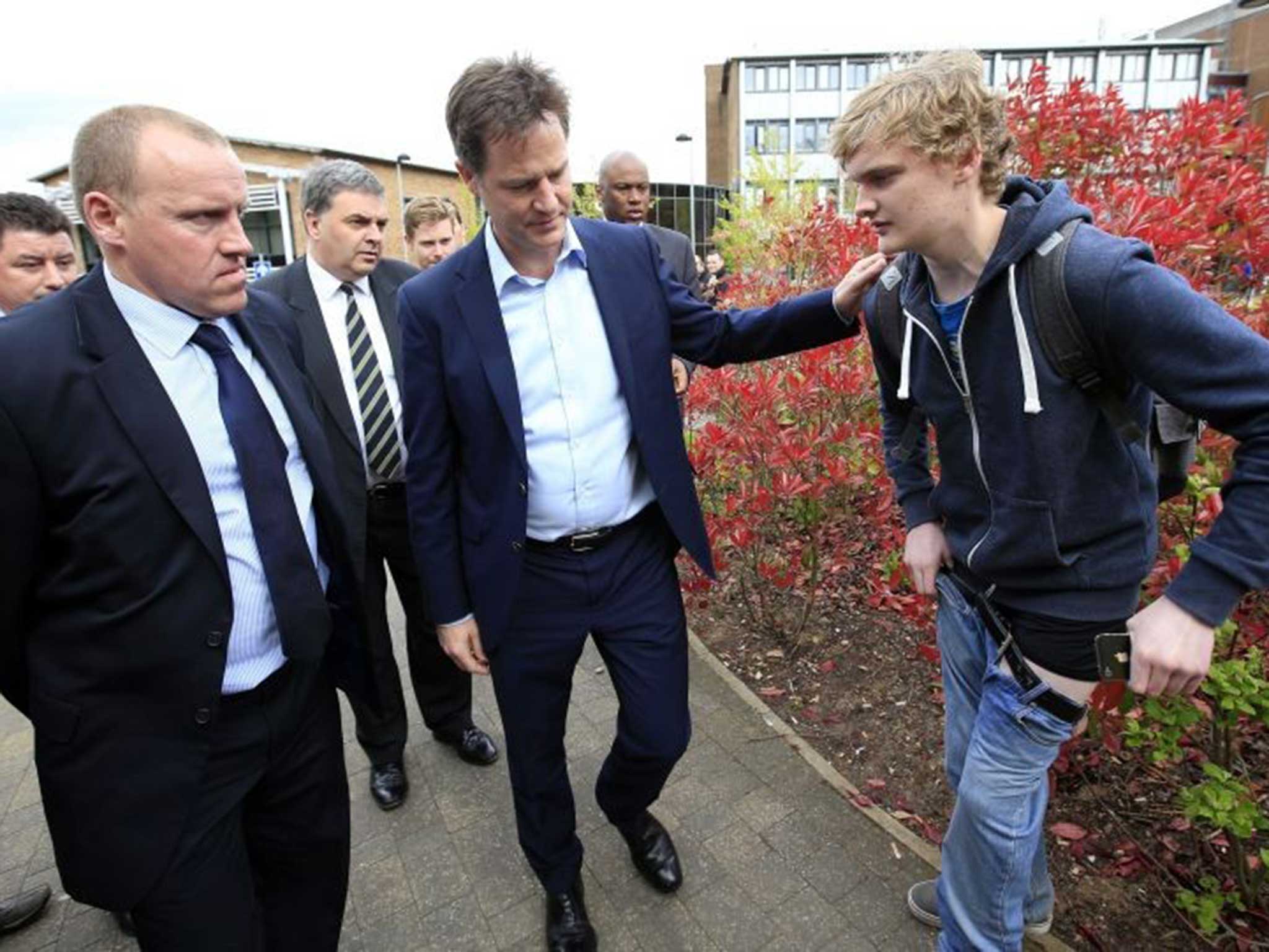 Nick Clegg appears unsure how to react to Mr Carrie's wardrobe malfunction