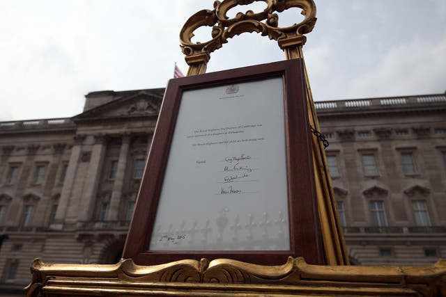 An easel is placed in the Forecourt of Buckingham Palace in London to announce the birth of a baby girl