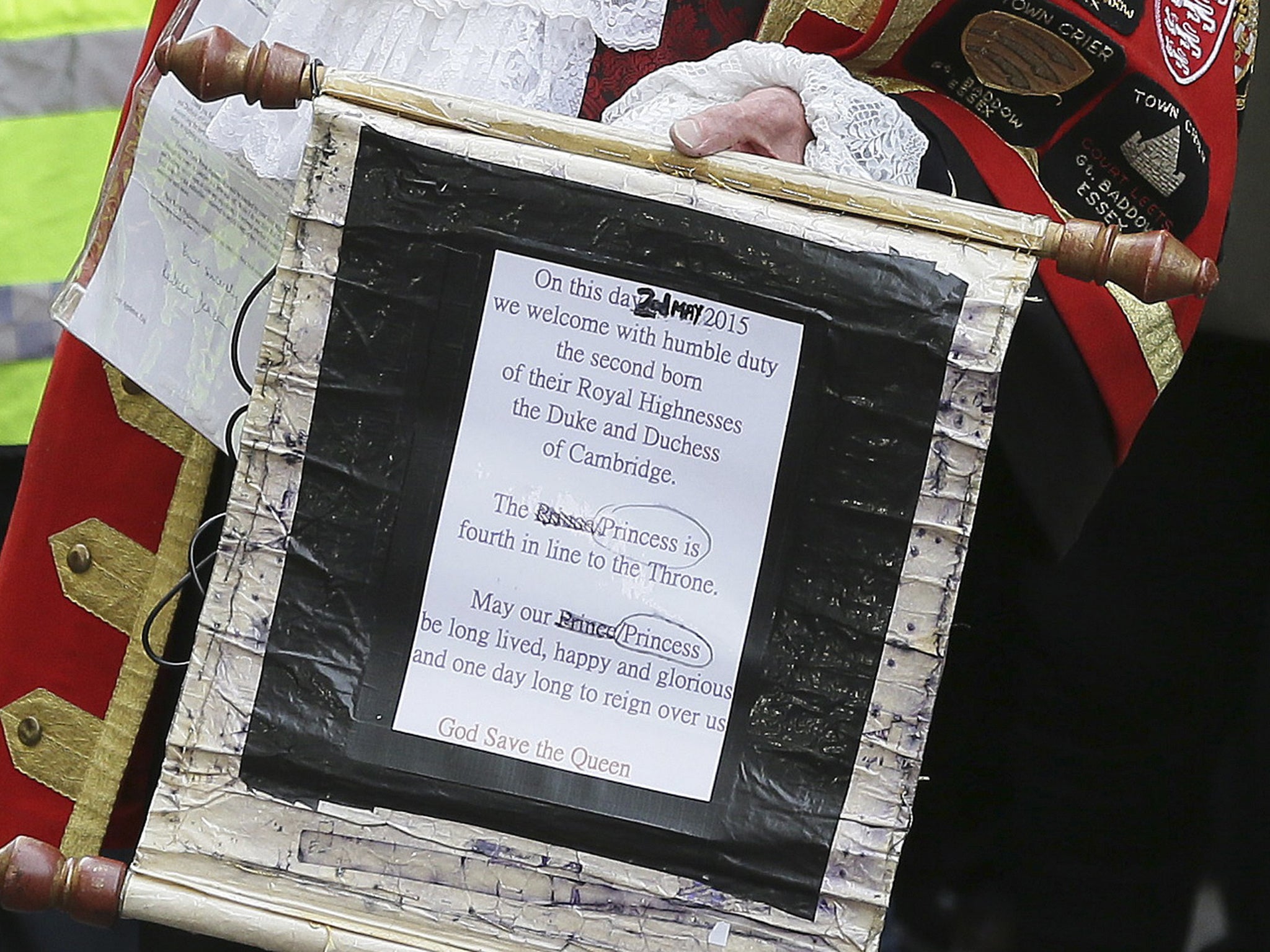 Tony Appleton, a town crier, announces to the assembled media the birth of the royal baby