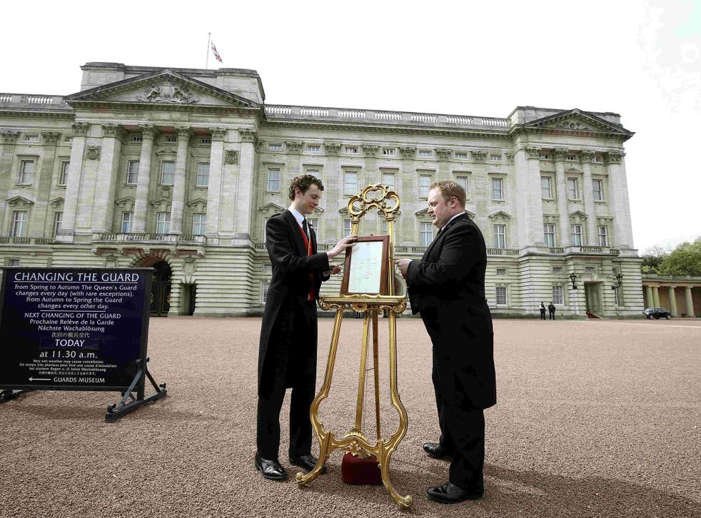 An easel is placed in the forecourt of Buckingham Palace announcing the birth of a baby girl to Catherine, Duchess of Cambridge