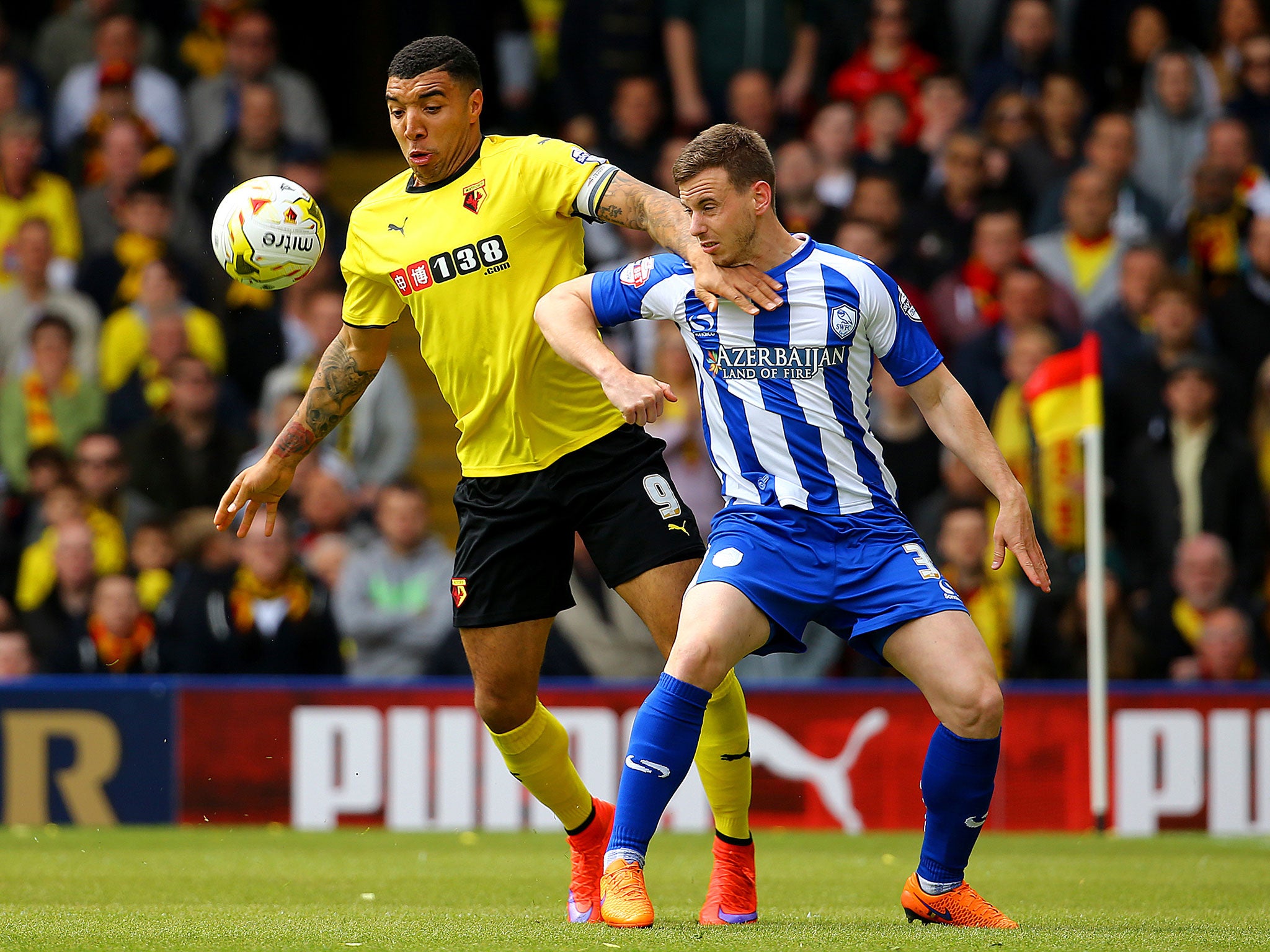 Watford's Troy Deeney battles for the ball