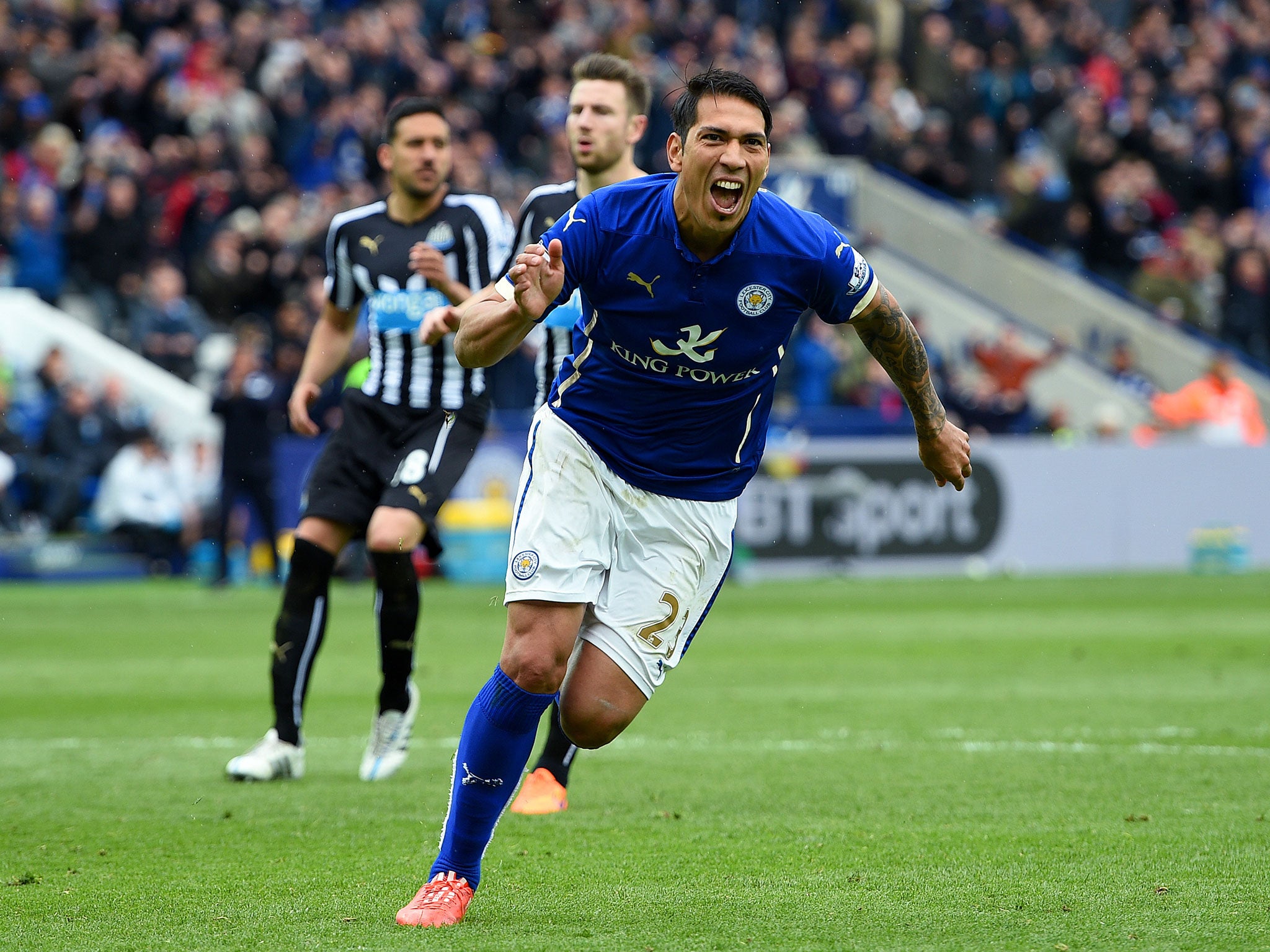 Leonardo Ulloa celebrates after scoring a penalty