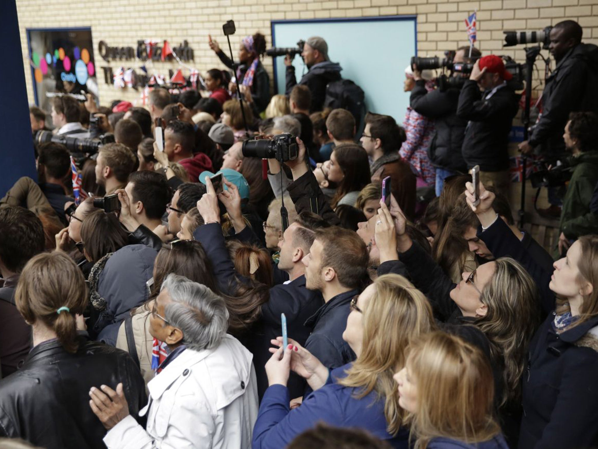 Well wishers and media gathered to take photos as Britain's Prince William left St. Mary's Hospital's exclusive Lindo Wing