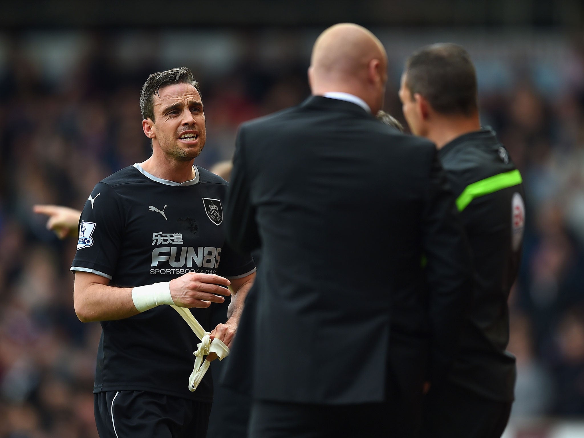 Michael Duff walks off the pitch after being sent off