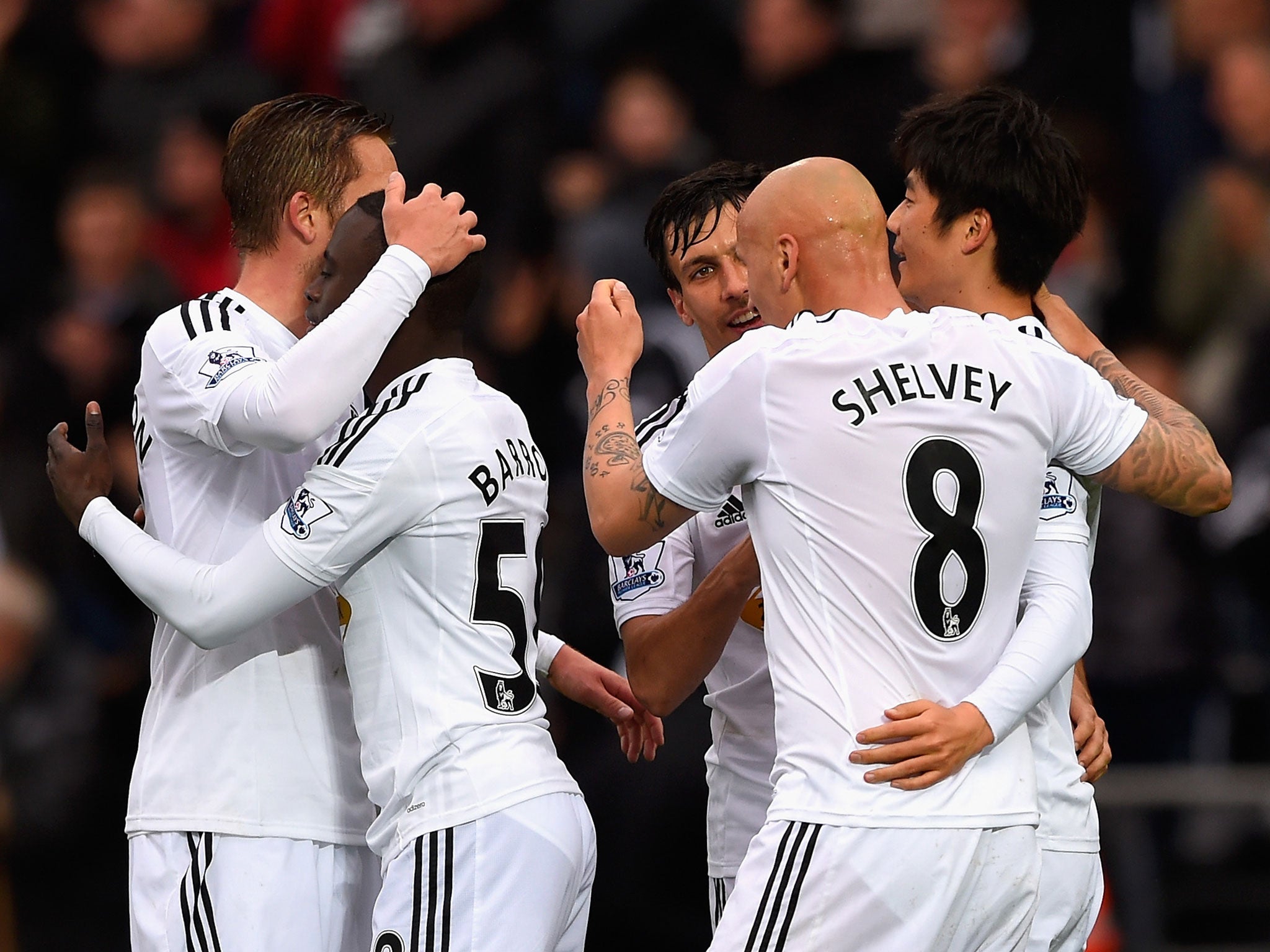 Swansea celebrate their second goal against Stoke