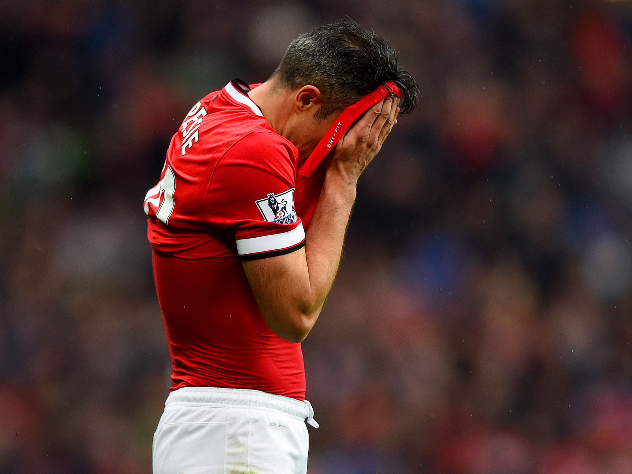 Robin van Persie reacts after his penalty is saved