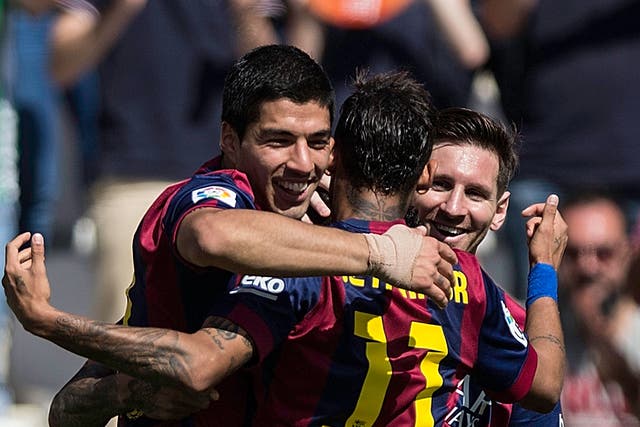Luis Suarez celebrates his first hat-trick for Barcelona with Neymar and Lionel Messi
