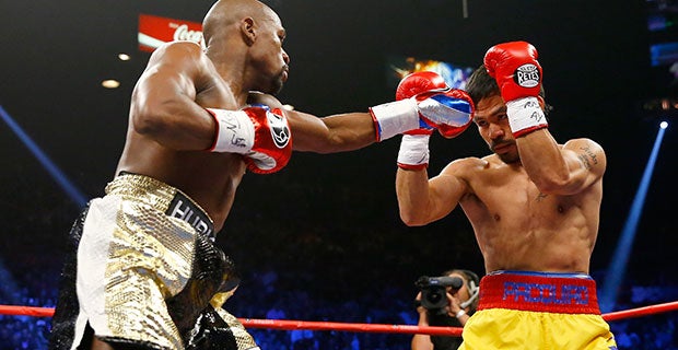 Floyd Mayweather hits Manny Pacquiao with a left jab