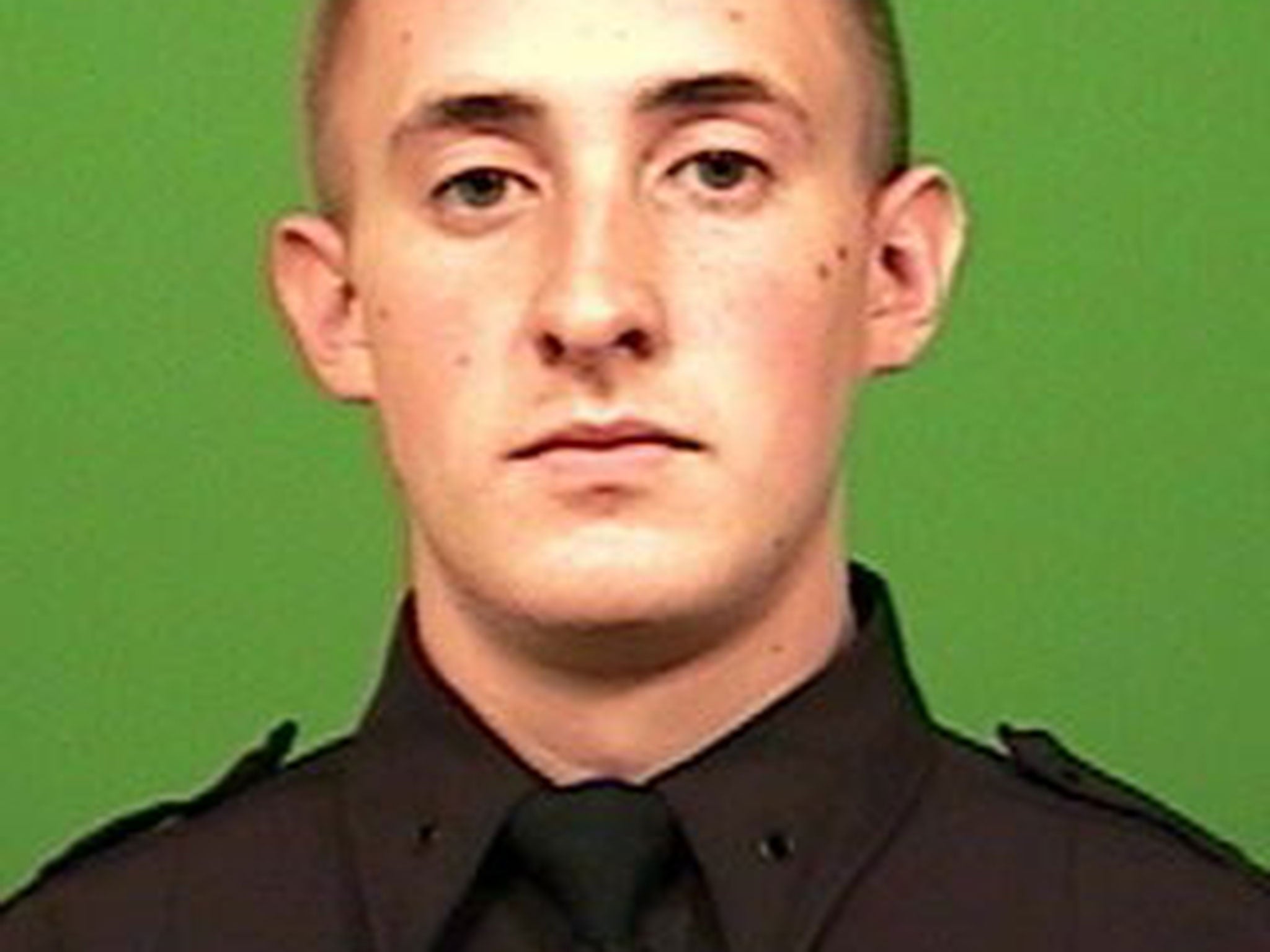 Photo released by the New York City Police Department shows officer Brian Moore, 25