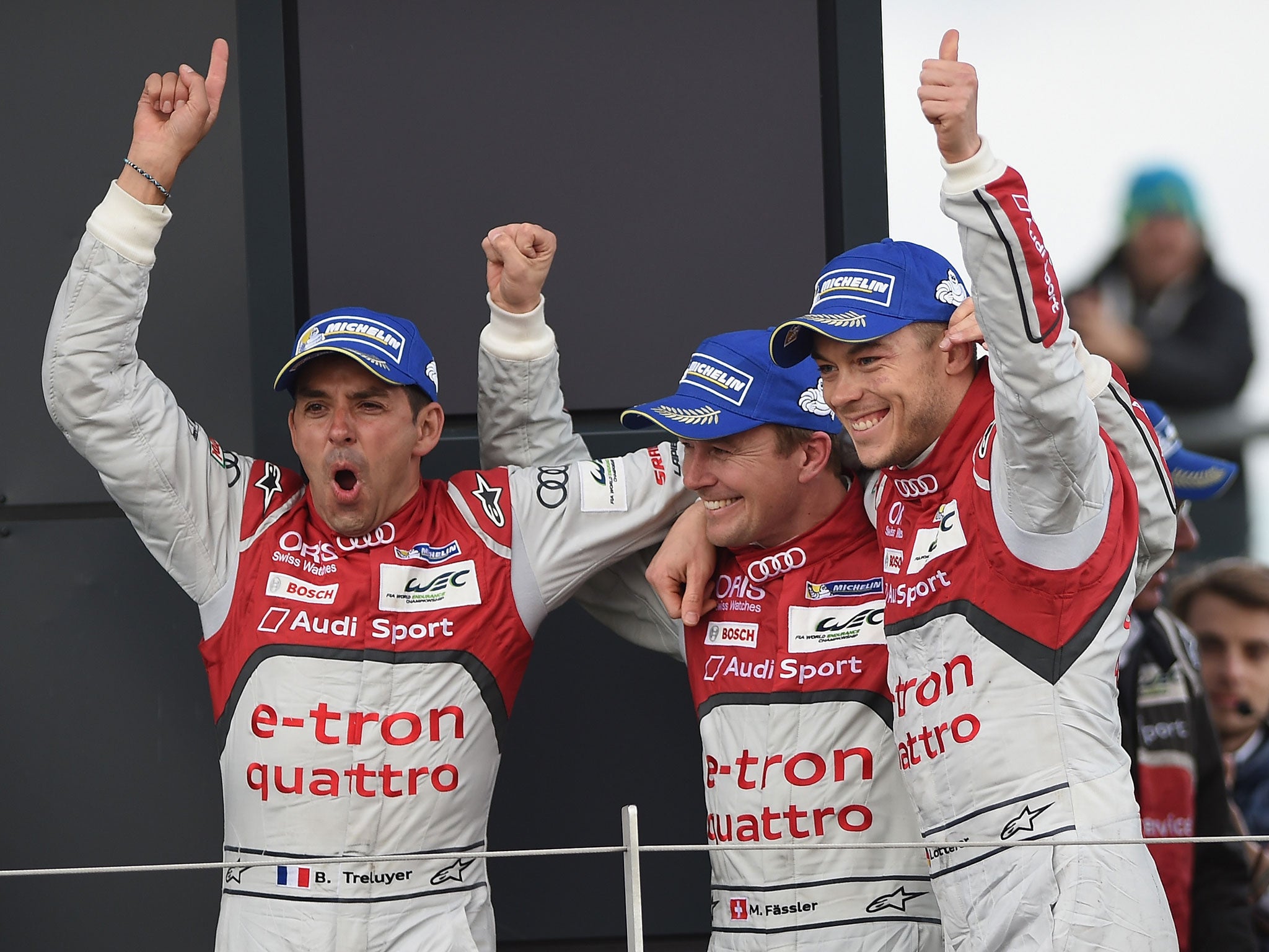 Benoit Treluyer, Marcel Fassler and Andre Lotterer celebrate victory