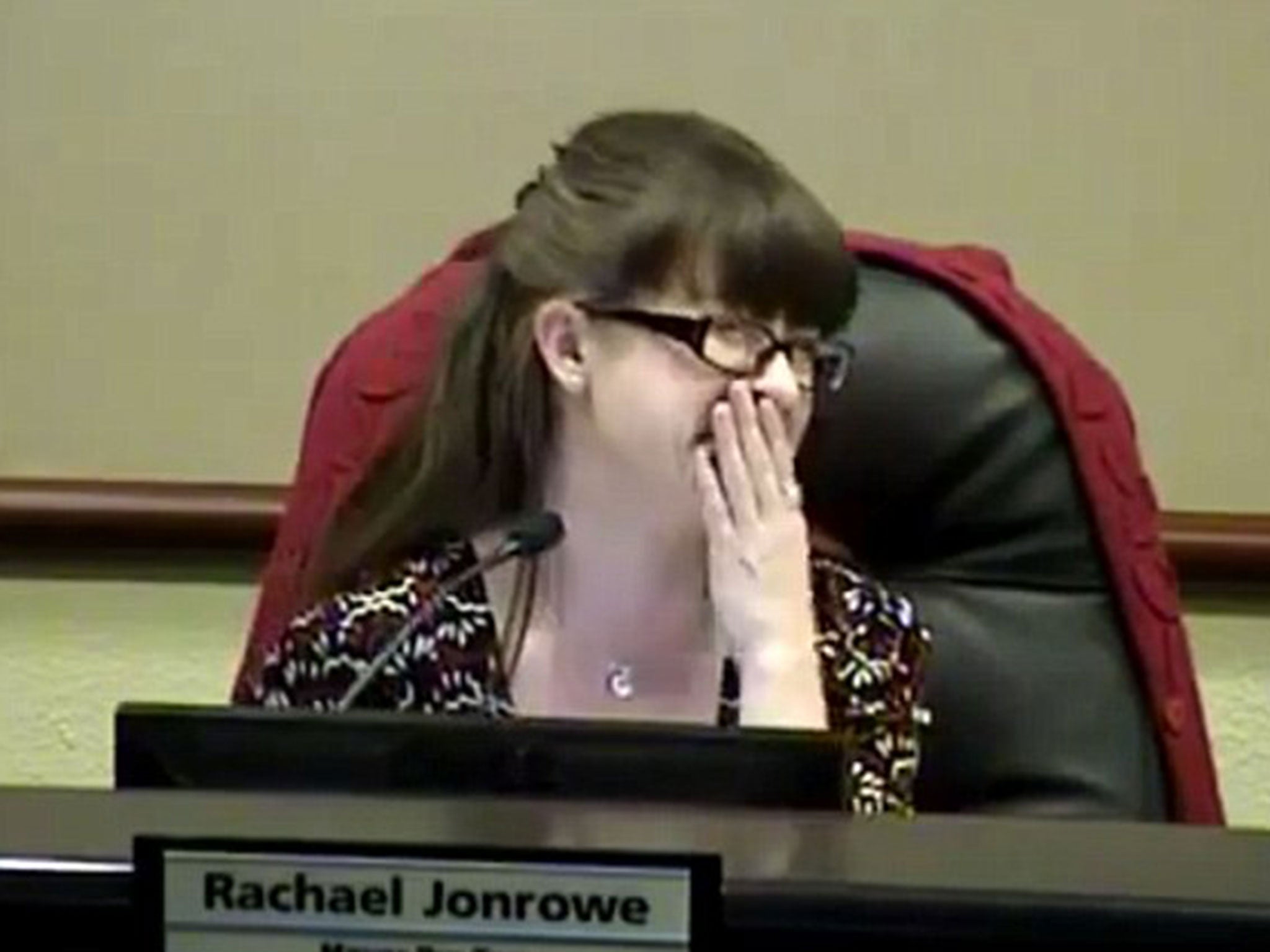 Johnrowe could barely contain her laughter during her speech
