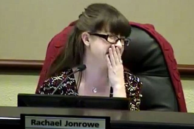 Johnrowe could barely contain her laughter during her speech