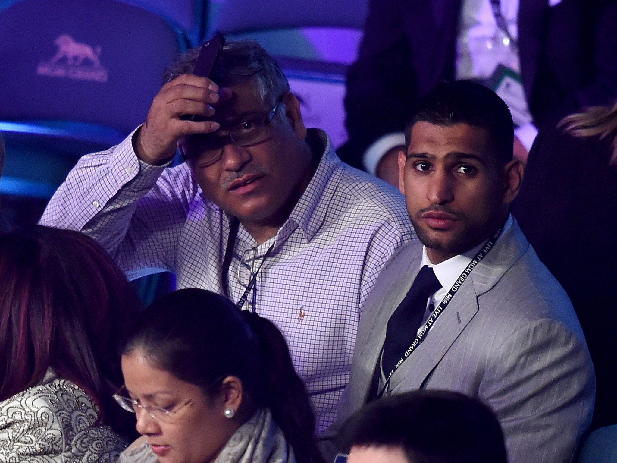 Amir Khan, ringside at the MGM in Las Vegas on Saturday, hopes to get a shot at Mayweather