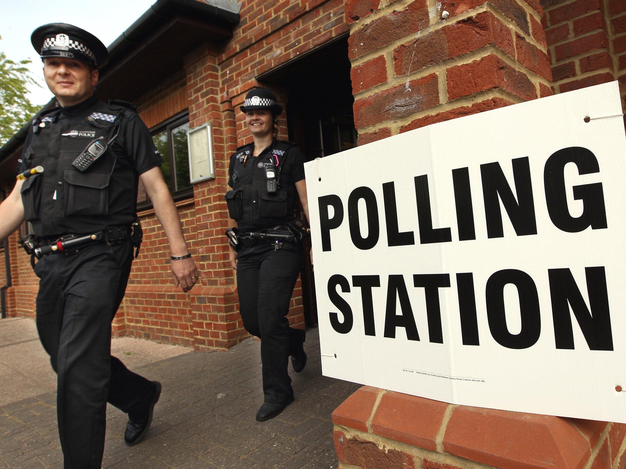 Police officers outside a polling station during the 2011 Alternative Vote national referendum, when Britain voted by 68 to 32 per cent against