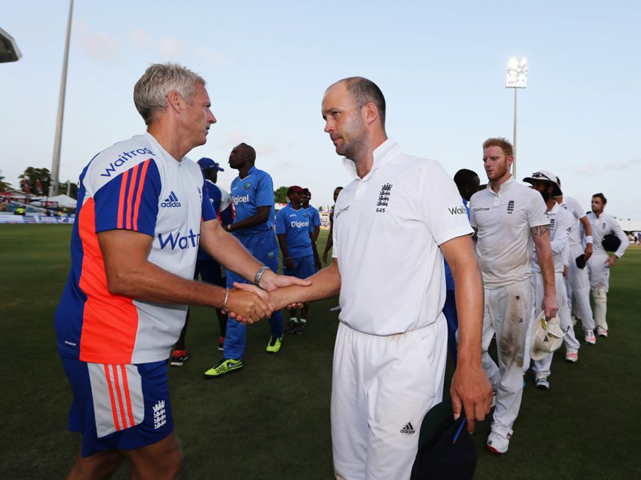 Peter Moores, left, shakes hands with Jonathan Trott after England’s humiliating defeat by West Indies