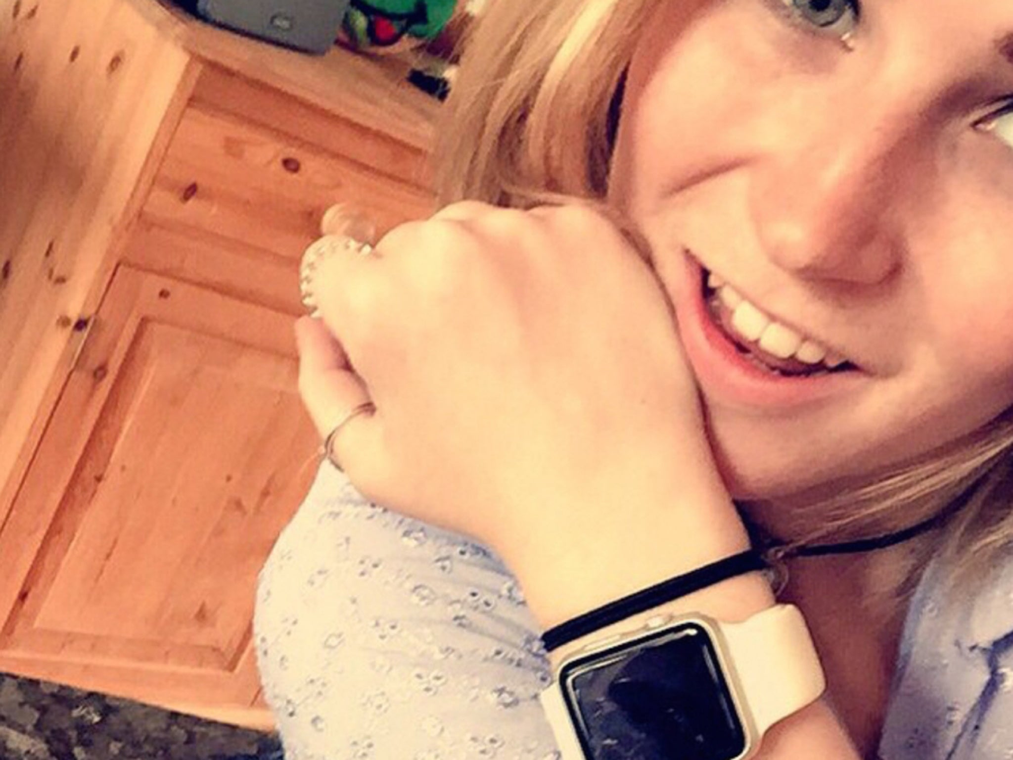 Molly Watt, wearing her Apple Watch Sport with a white band