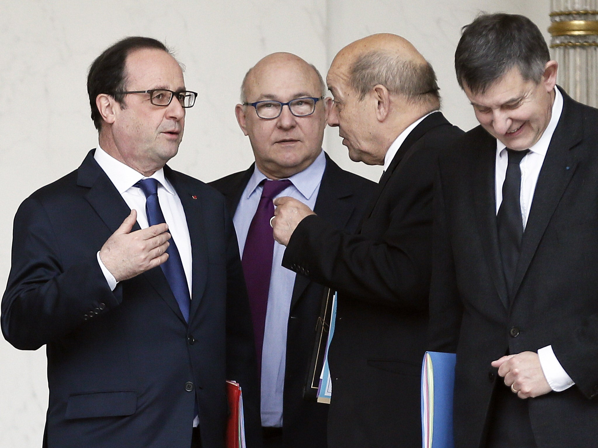 File photo: President François Hollande speaks with senior French politicians