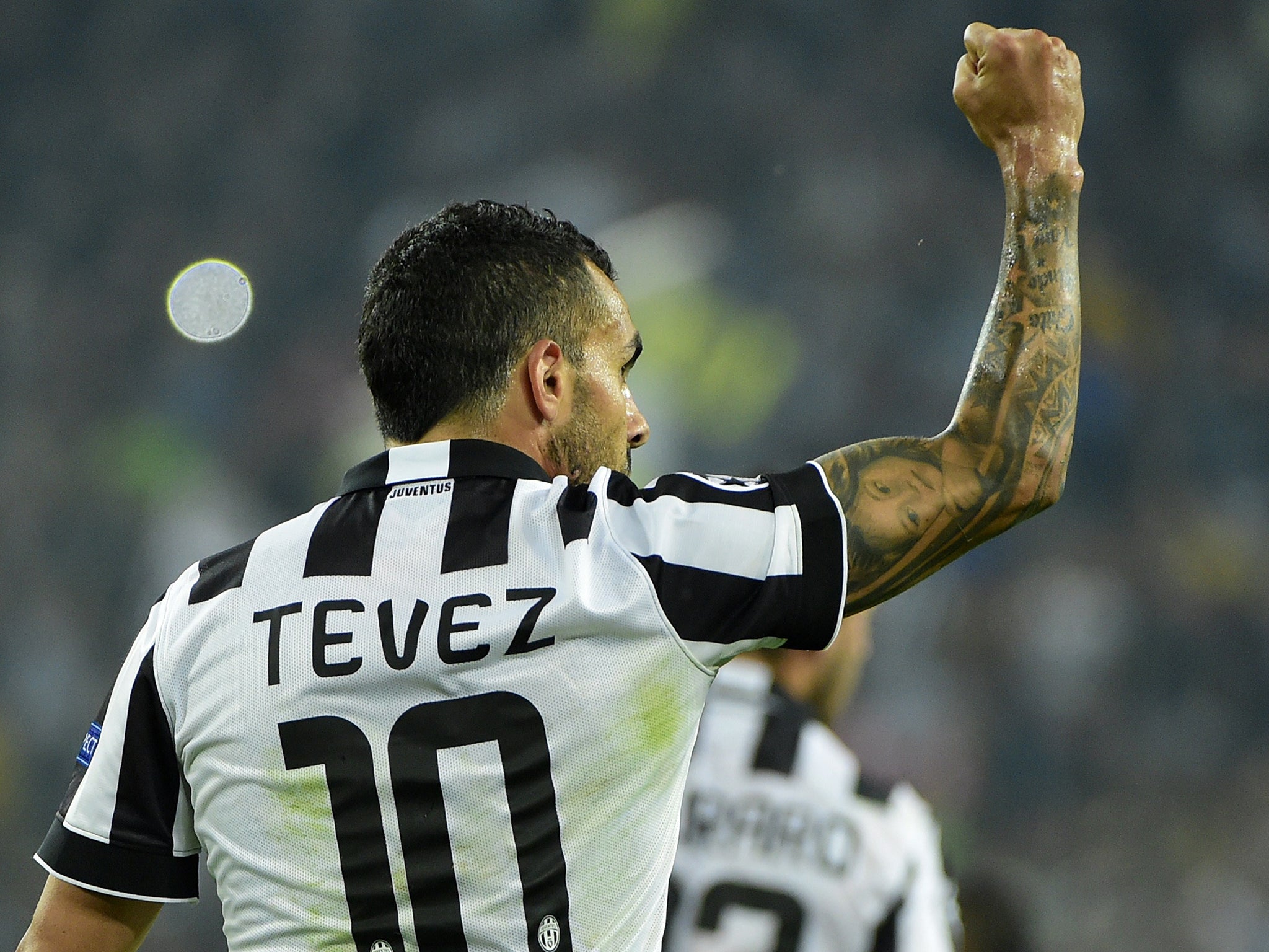 Carlos Tevez celebrates during Juventus' win over Real Madrid