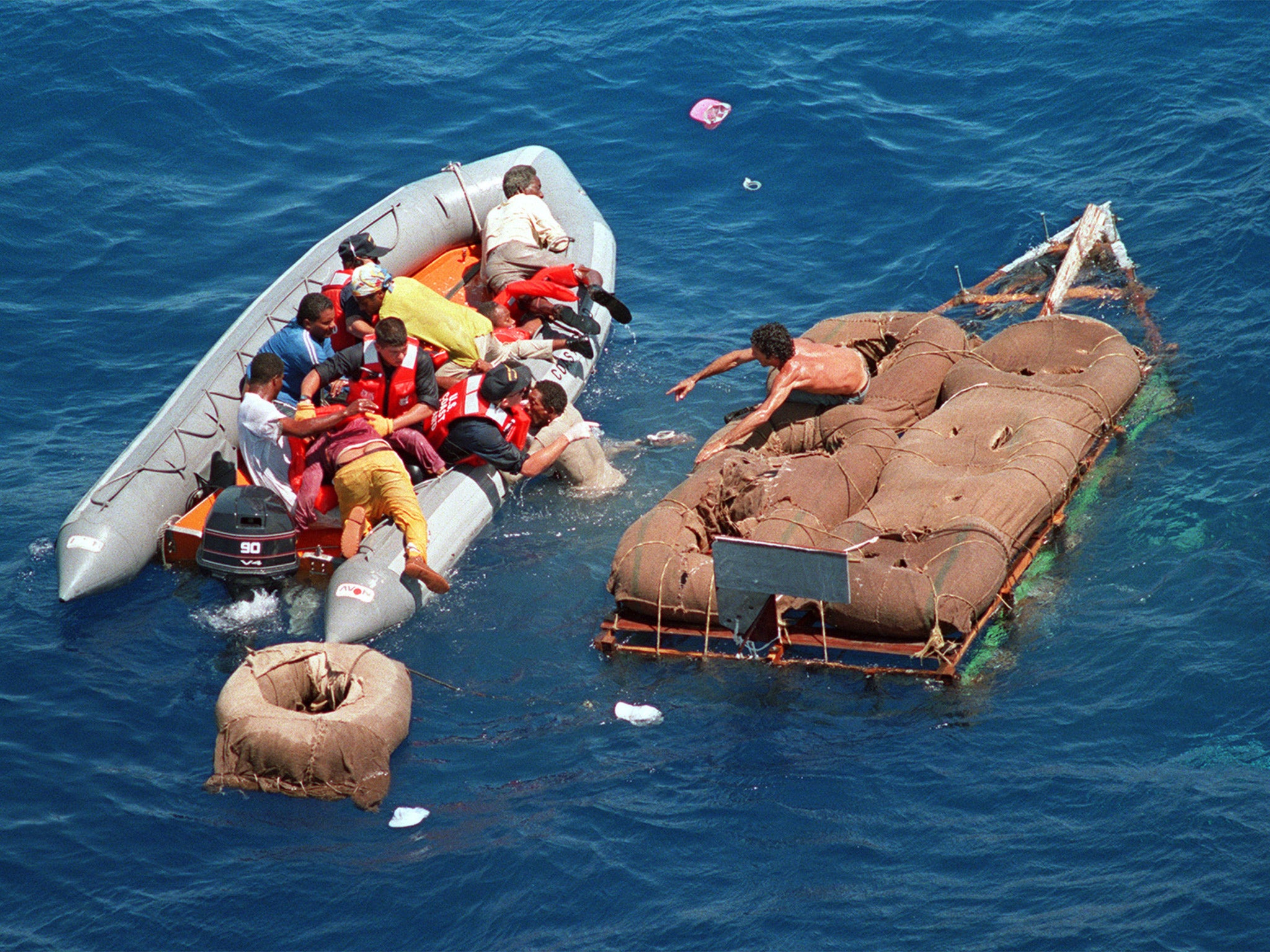 Cuban refugees are rescued from a raft