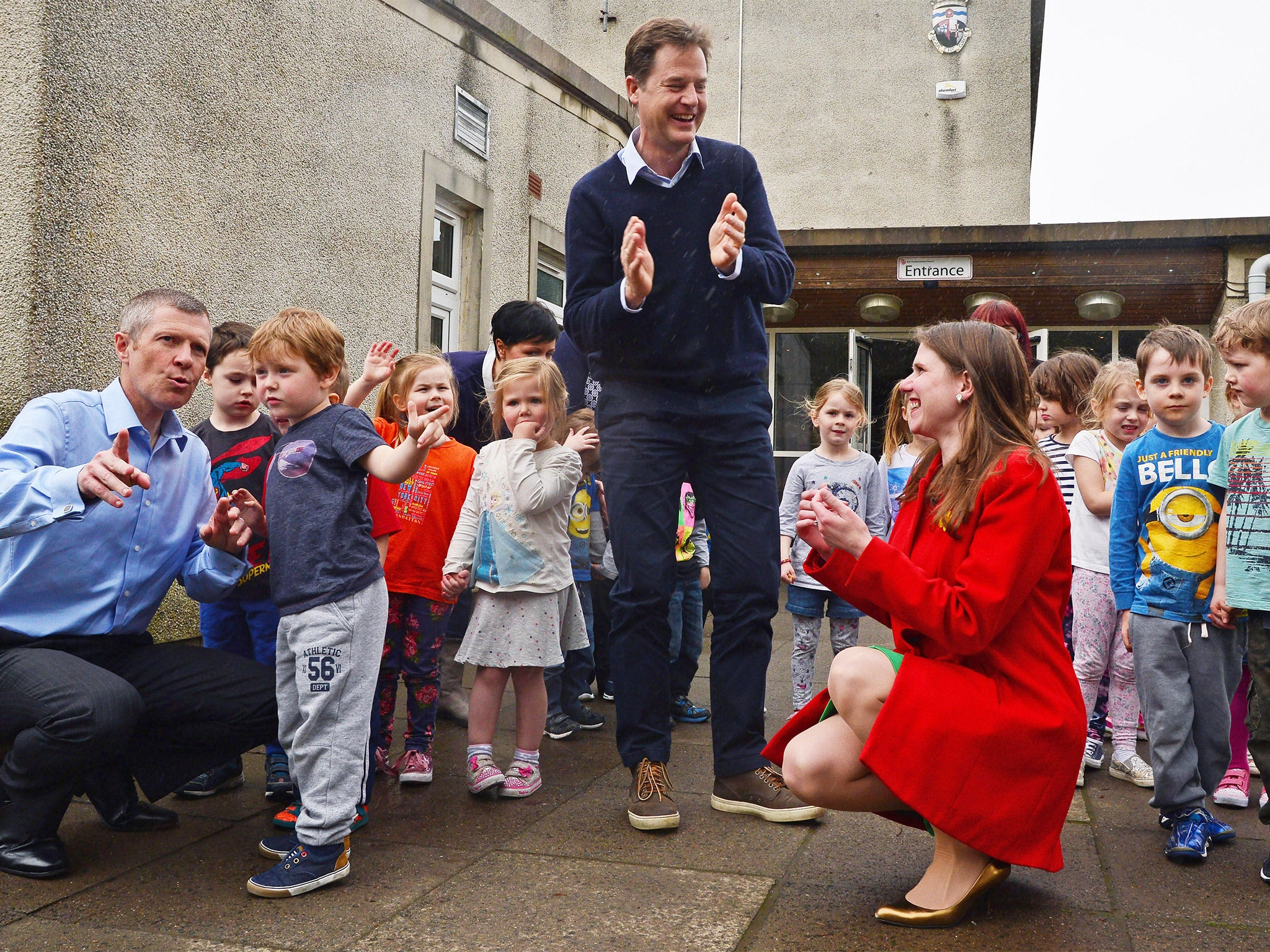 Nick Clegg, with the leader of the Scottish Lib Dems Willie Rennie (left), and parliamentary candidate Jo Swinson, at the Westerton Nursery in Bearsden, near Glasgow, on Wednesday