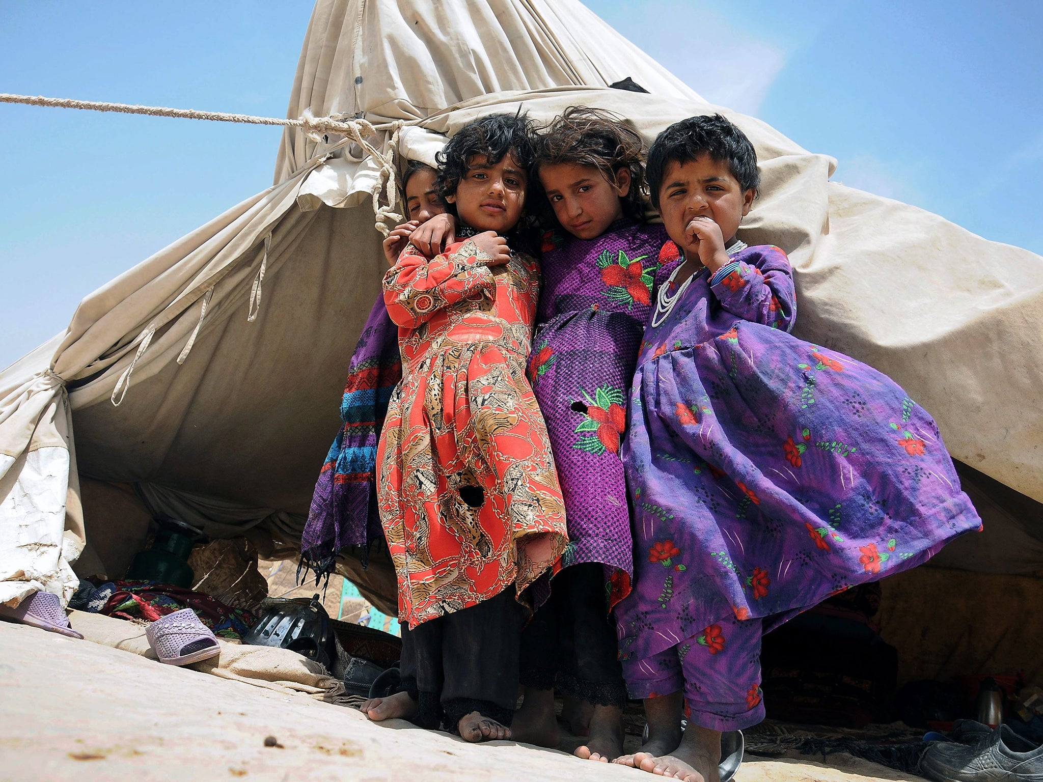 Young Afghans displaced from their homes in a camp in Mazar-i-Sharif