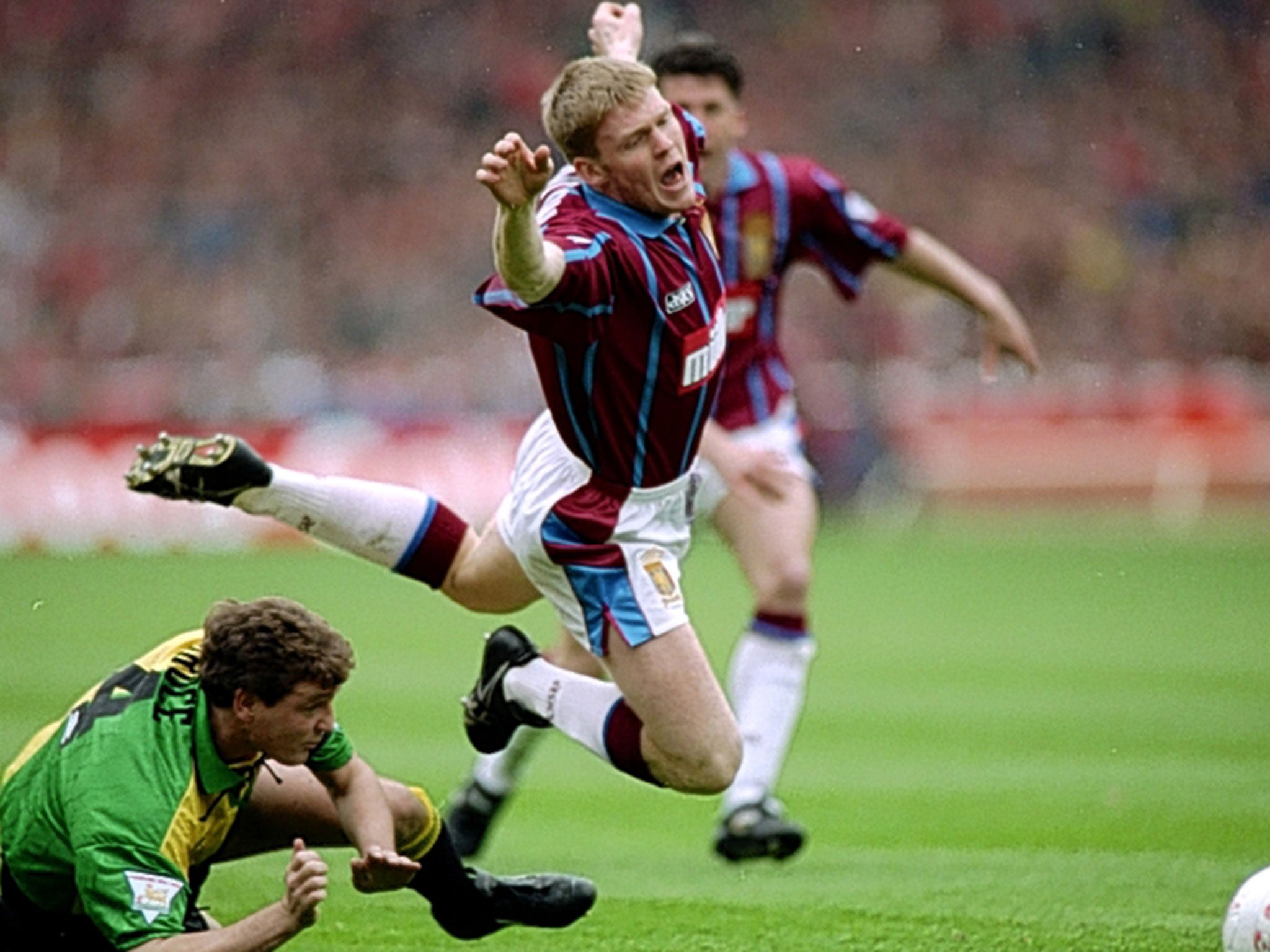 Graham Fenton is tackled by Manchester United’s Steve Bruce at Wembley in the 1994 League Cup final, which Aston Villa won 3-1