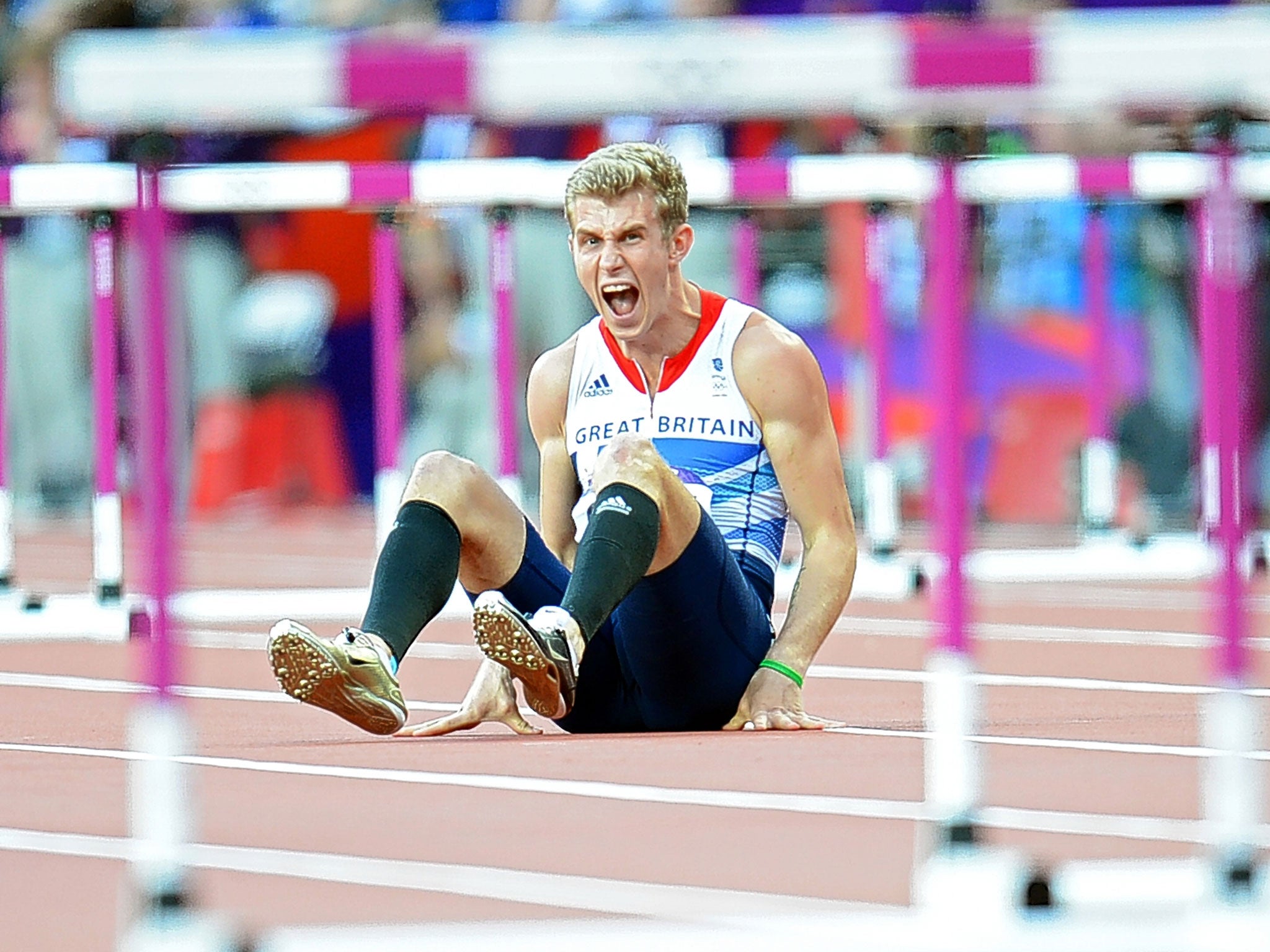 Jack Green shows his despair after falling in the semi-finals of the men’s 400m hurdles at the London Olympics