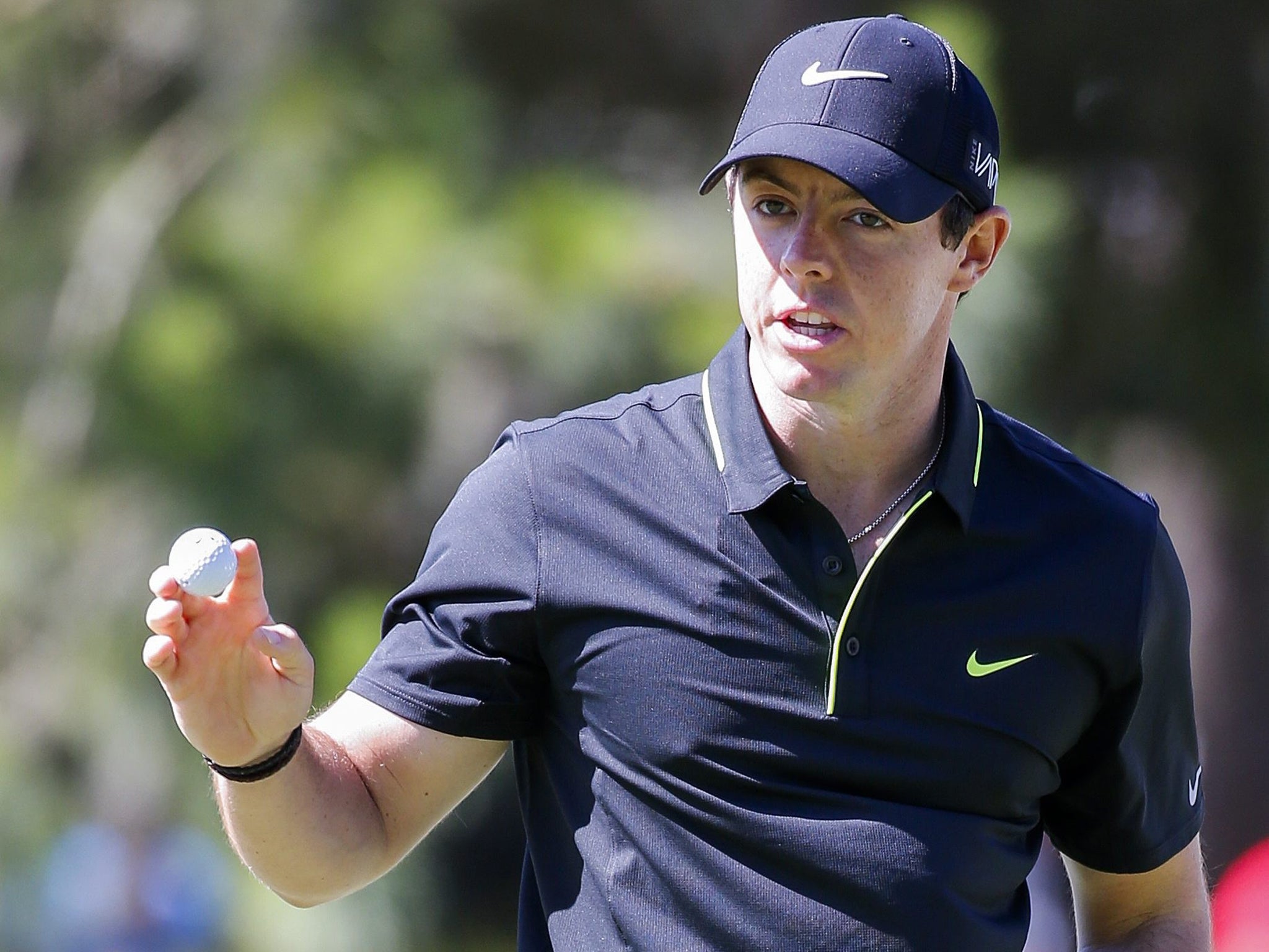 Rory McIlroy celebrates making a putt on the 15th