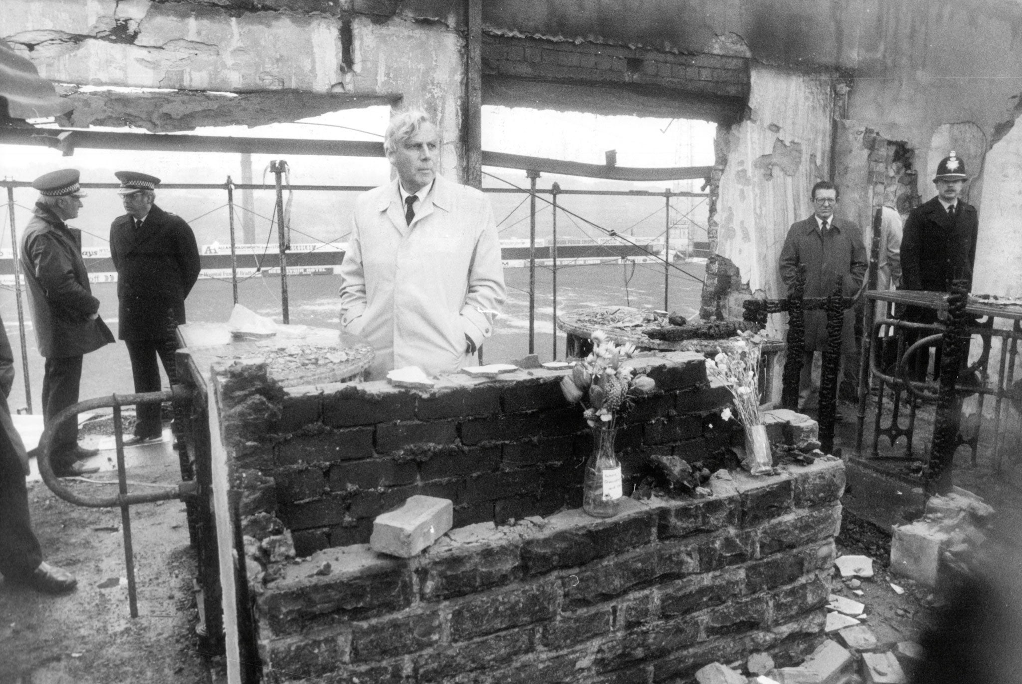 Mr Justice Popplewell, who led the inquiry into the fire, at the 'Turnstile Shrine' in the stadium (Rex)