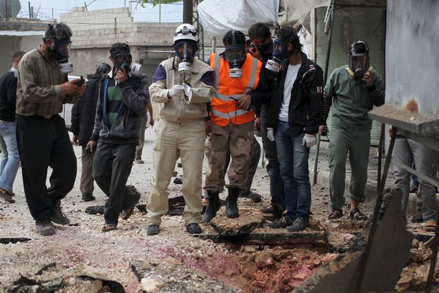 Syria's Civil Defence members after what activists claim was an earlier chemical attack on 3 May
