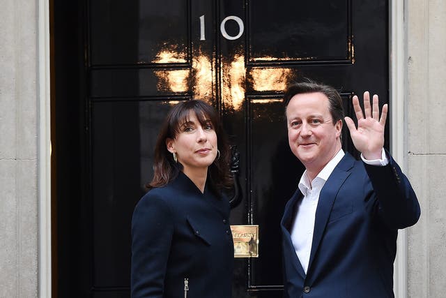 Prime Minister David Cameron and his wife Samantha arrive to N10 Downing street in London 