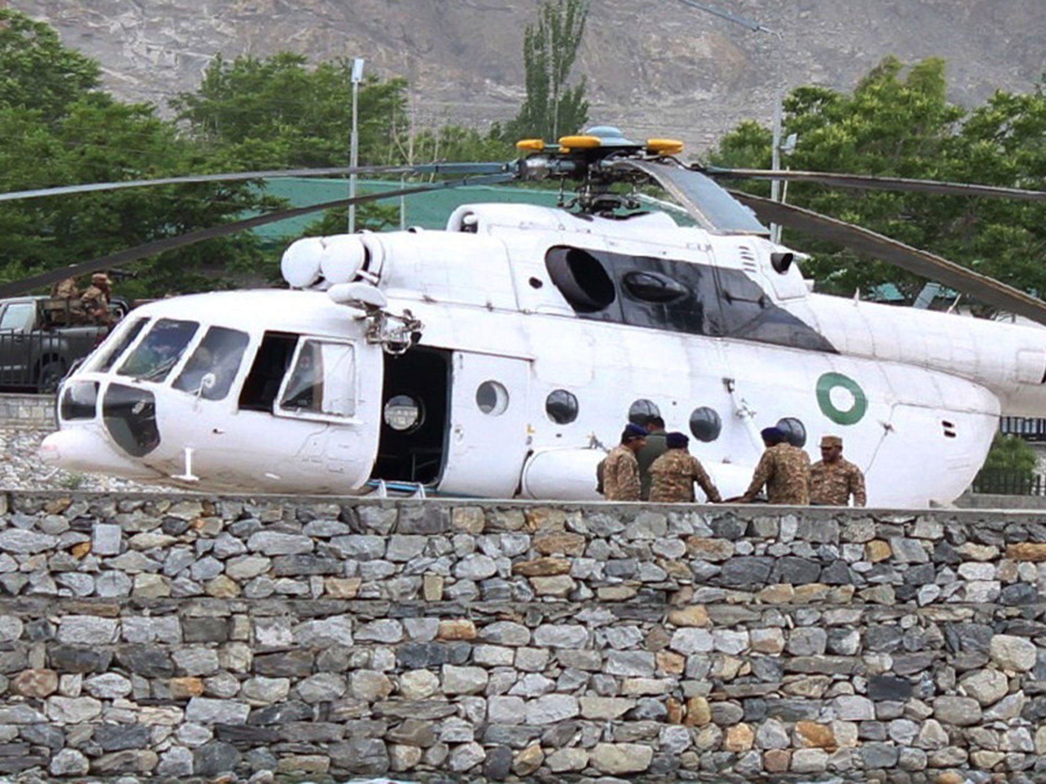 A Pakistani army helicopter carries survivors to hospital