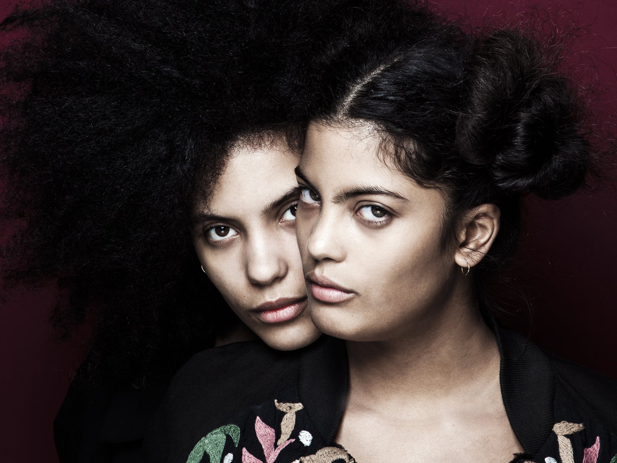 The French duo Ibeyi look through the camera in Paris